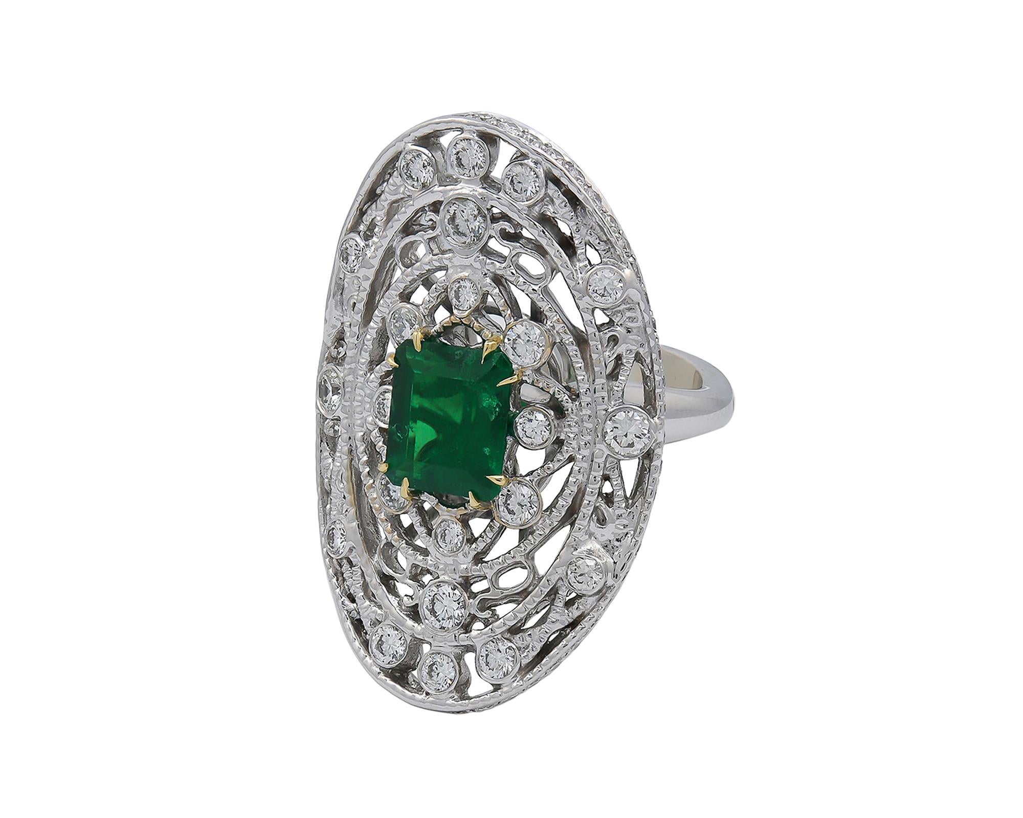 This precious green emerald, weighing 2.18 carats is the rich center of attention in this Belle Époque meets Art Deco-style 18kt white gold and diamond shield ring created by Spectra Fine Jewelry in 2020. The ring beautifully demonstrates modern