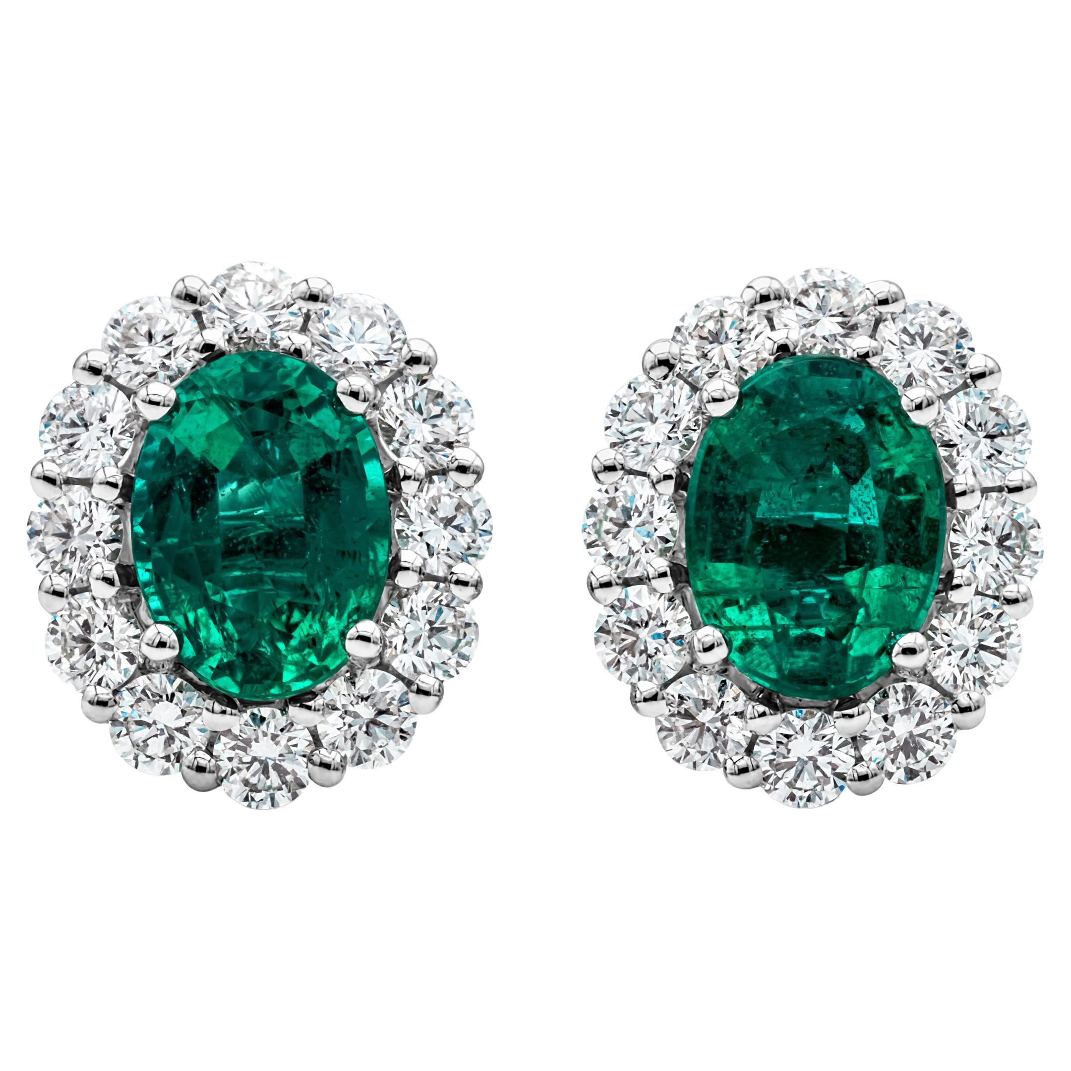2.18 Carats Total Oval Cut Green Emerald and Diamond Halo Stud Earrings
