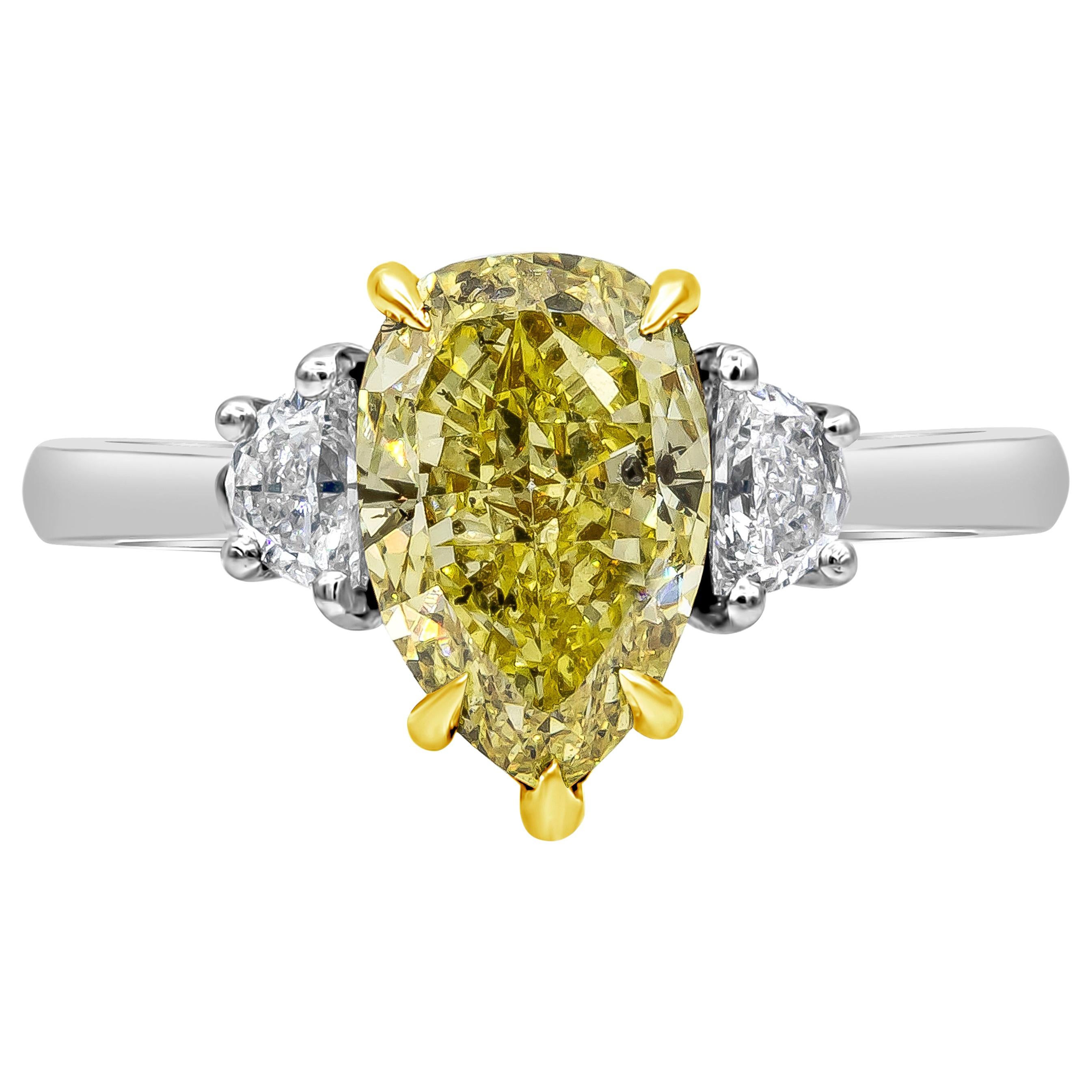 2.18 Carats Pear Shape Fancy Intense Yellow Diamond Three-Stone Engagement Ring For Sale