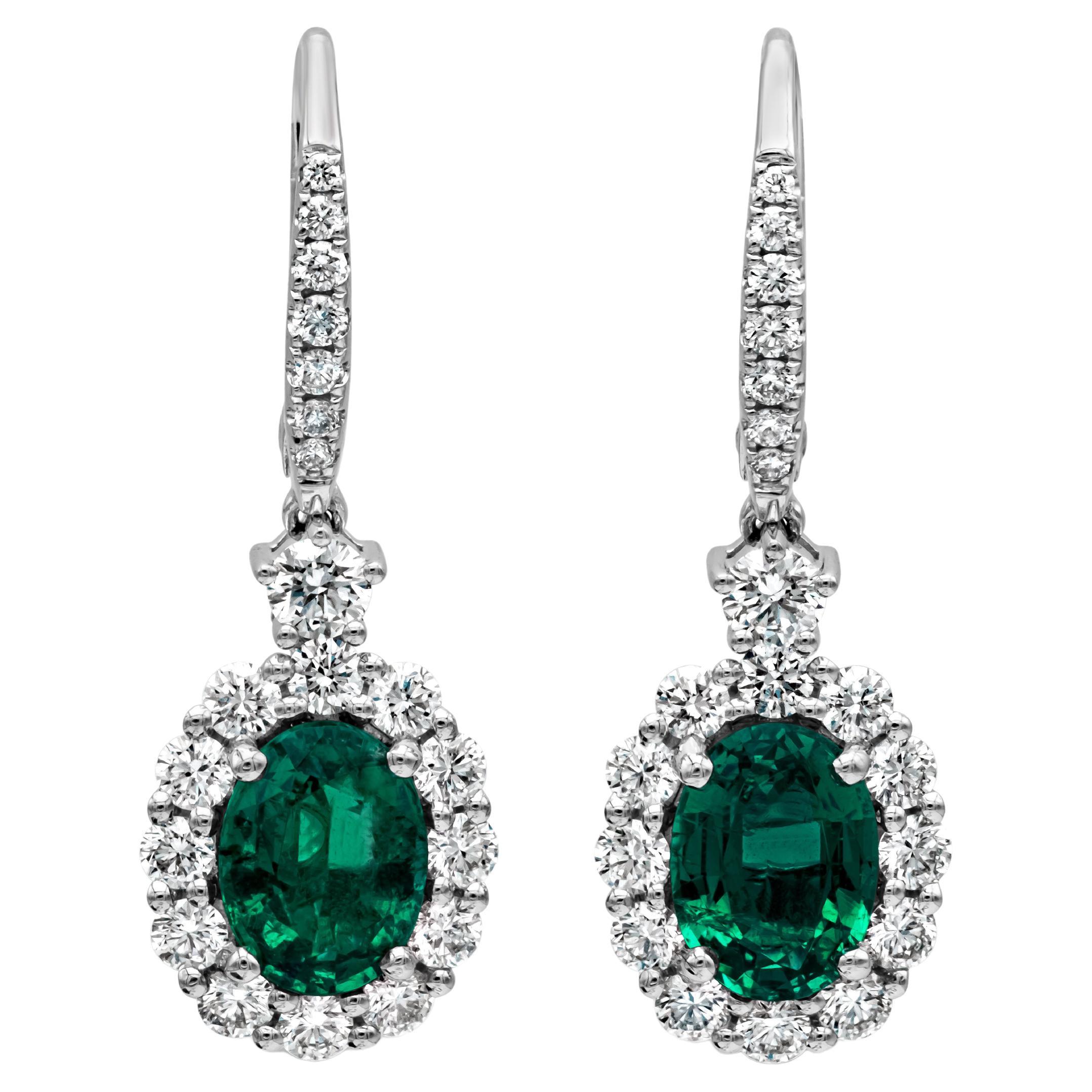  2.18 Carat Oval Emerald and Diamond Halo Dangle Earrings