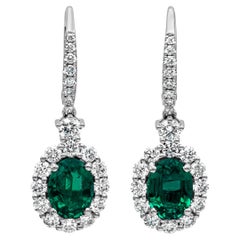  2.18 Carat Oval Emerald and Diamond Halo Dangle Earrings