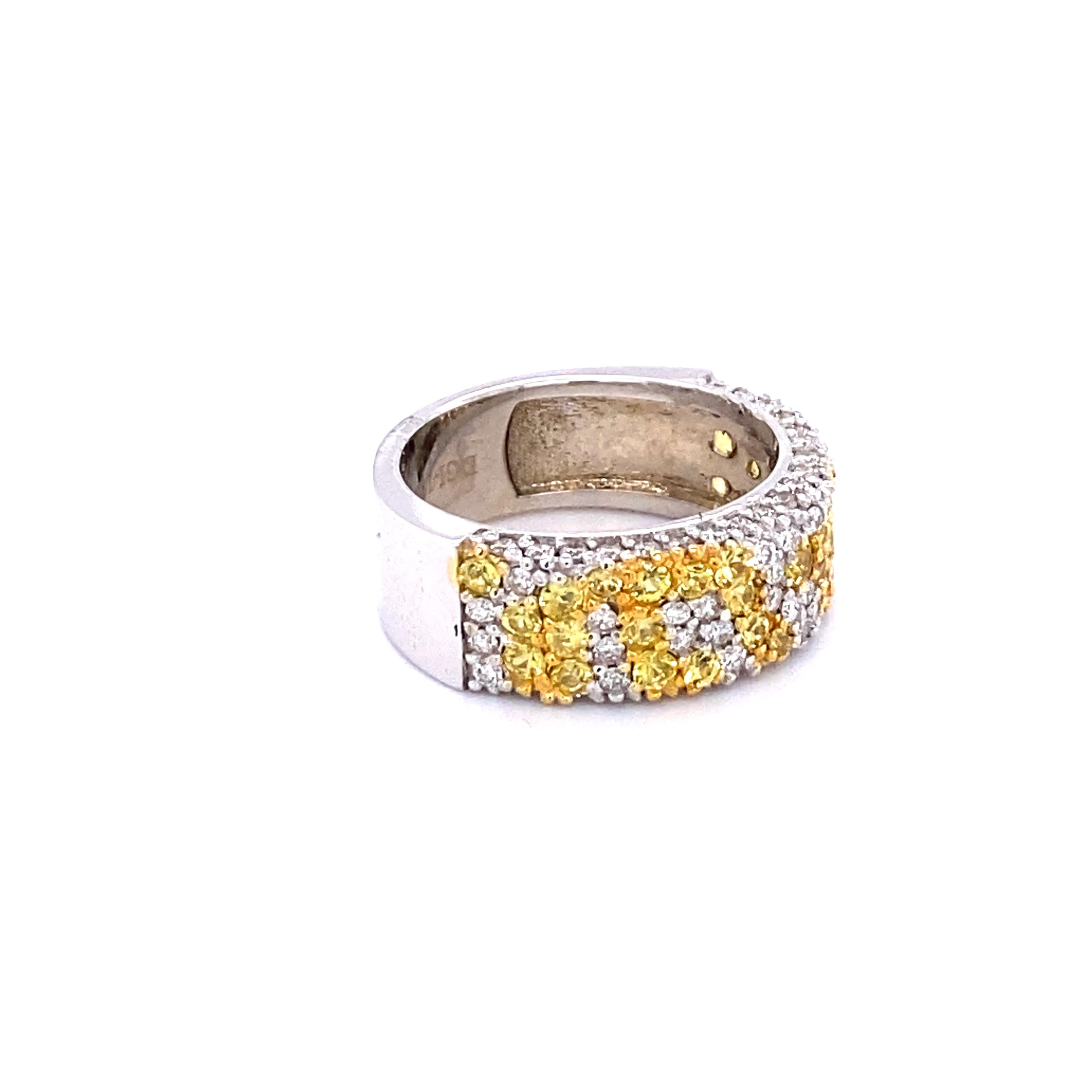 This unique band has a cluster of 35 Yellow Sapphires that weighs 1.27 Carats and 75 Round Cut Diamonds that weigh 0.91 Carats.  The diamonds have a clarity of VS and color of H. The Total Carat Weight of the Band is 2.18 Carats.
The band is crafted
