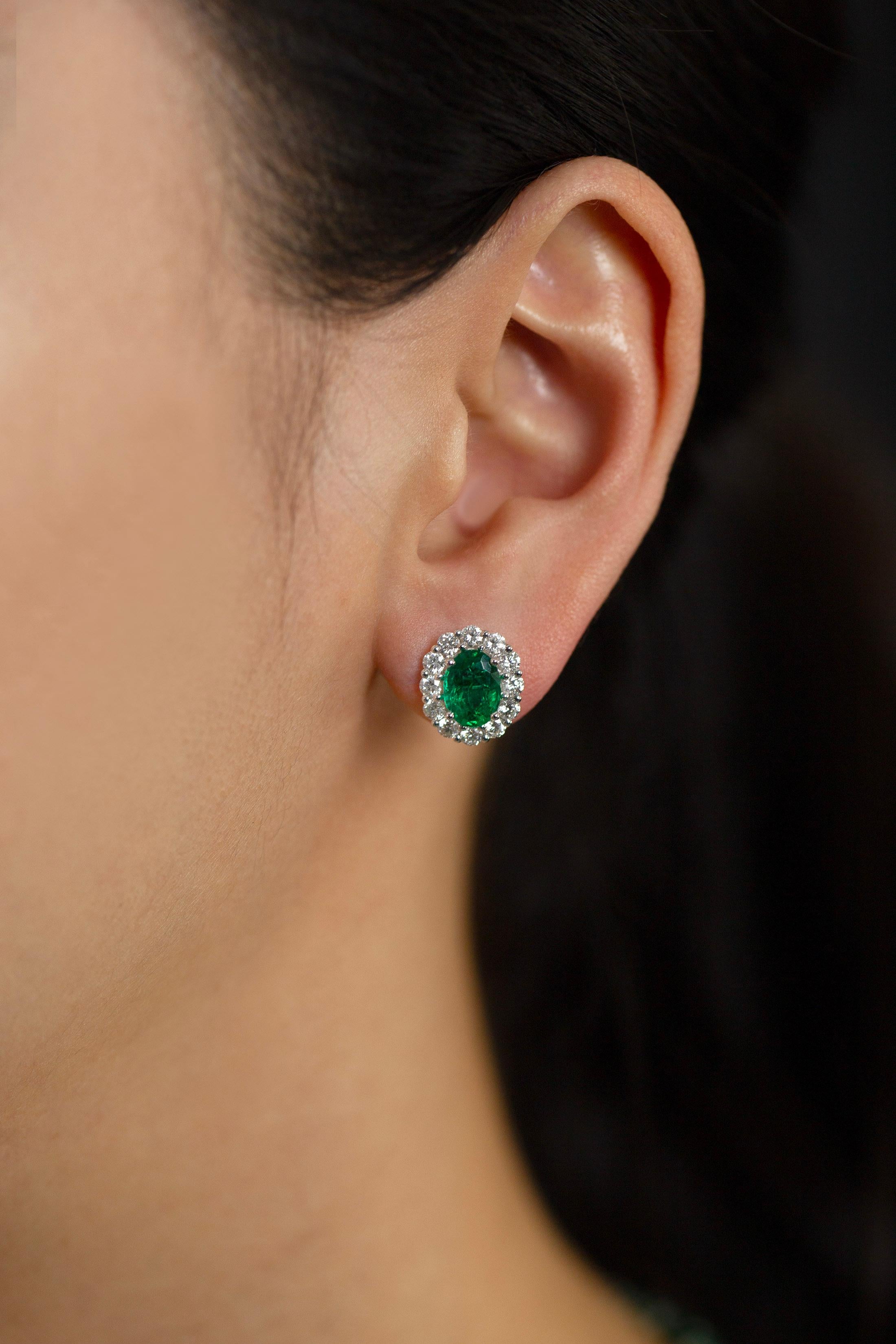 2.18 Carats Total Oval Cut Green Emerald and Diamond Halo Stud Earrings In New Condition For Sale In New York, NY