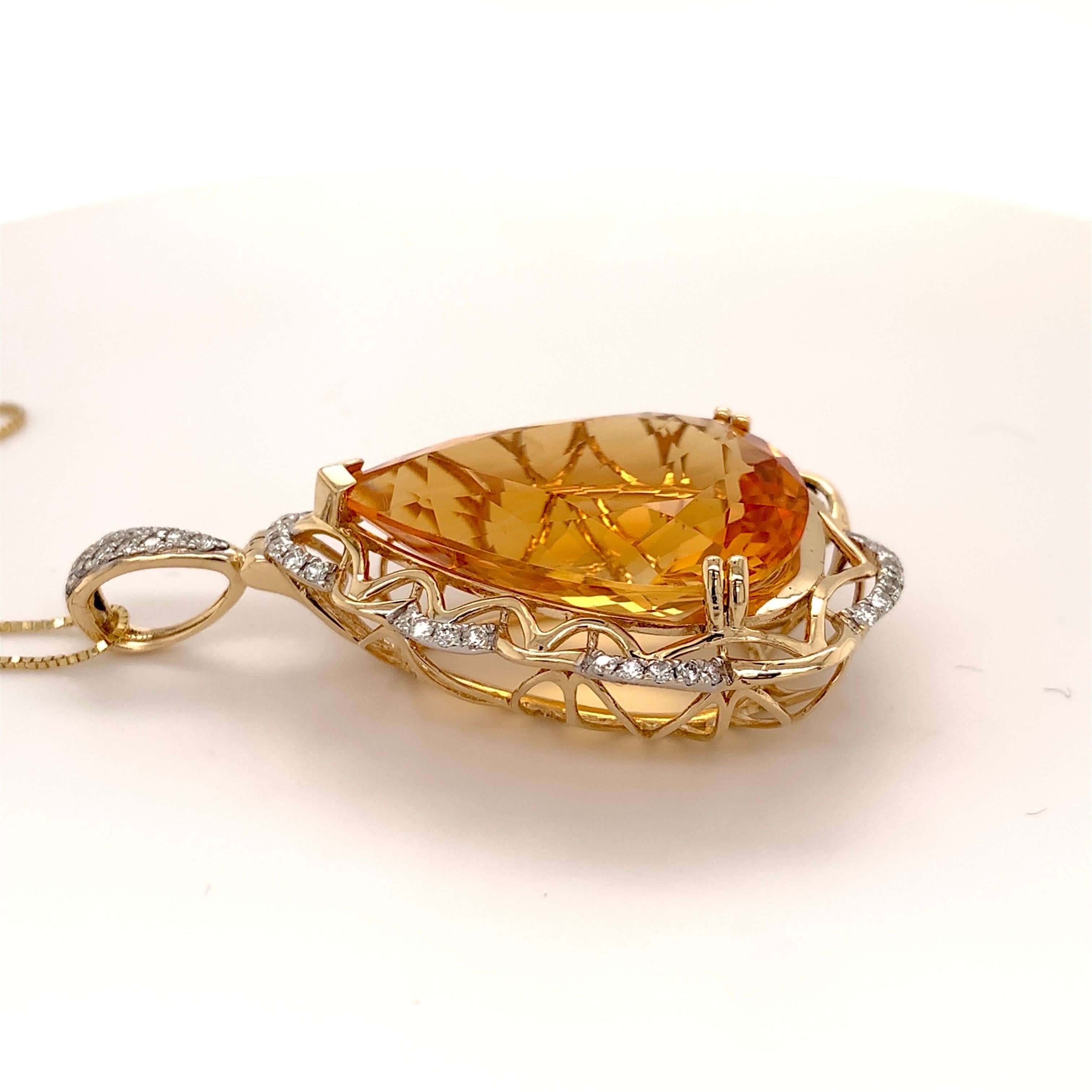 Stunning citrine diamond pendant. High brilliance, golden honey tone, transparent clean, pear shape faceted, natural 21.84 carats citrine mounted on high profile open basket with 4 bead prongs and knife prong, accented with round brilliant cut