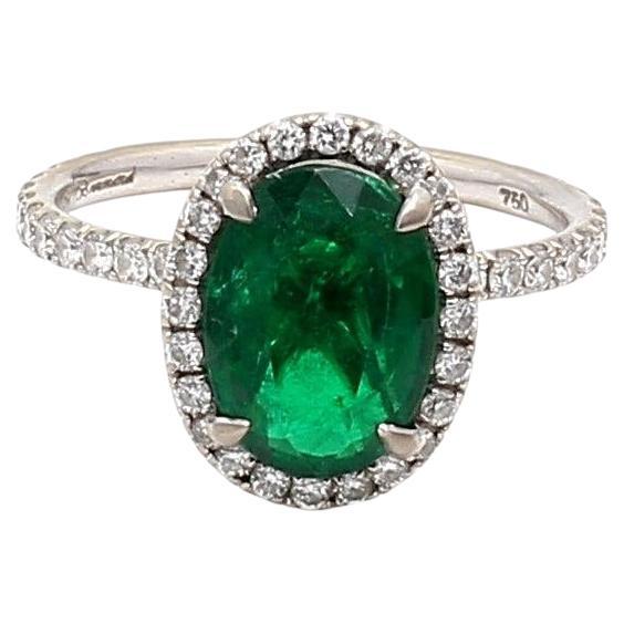 2.19 Carat Emerald 0.60 Carat Round Diamond 18 Karat White Gold Halo Ring