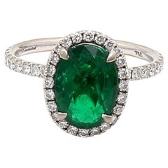 2.19 Carat Emerald 0.60 Carat Round Diamond 18 Karat White Gold Halo Ring