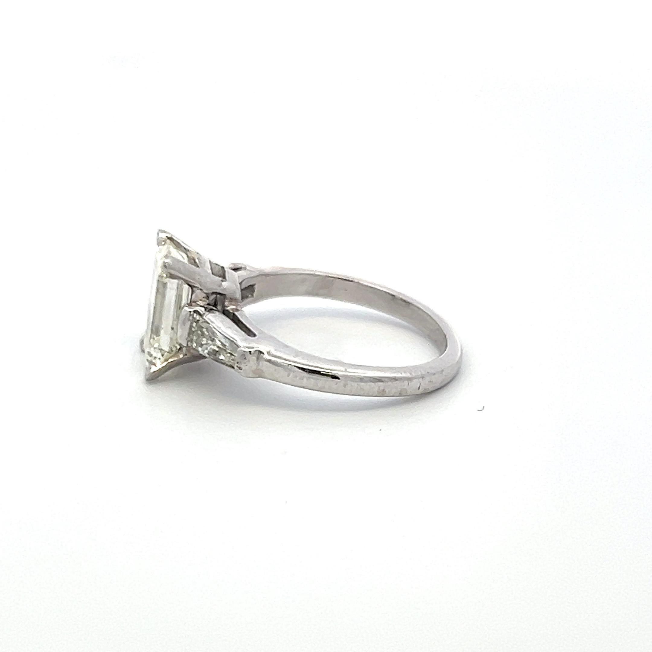 Women's 2.19 Carat Emerald Cut and Tapered Baguette Diamond Platinum Engagement Ring For Sale