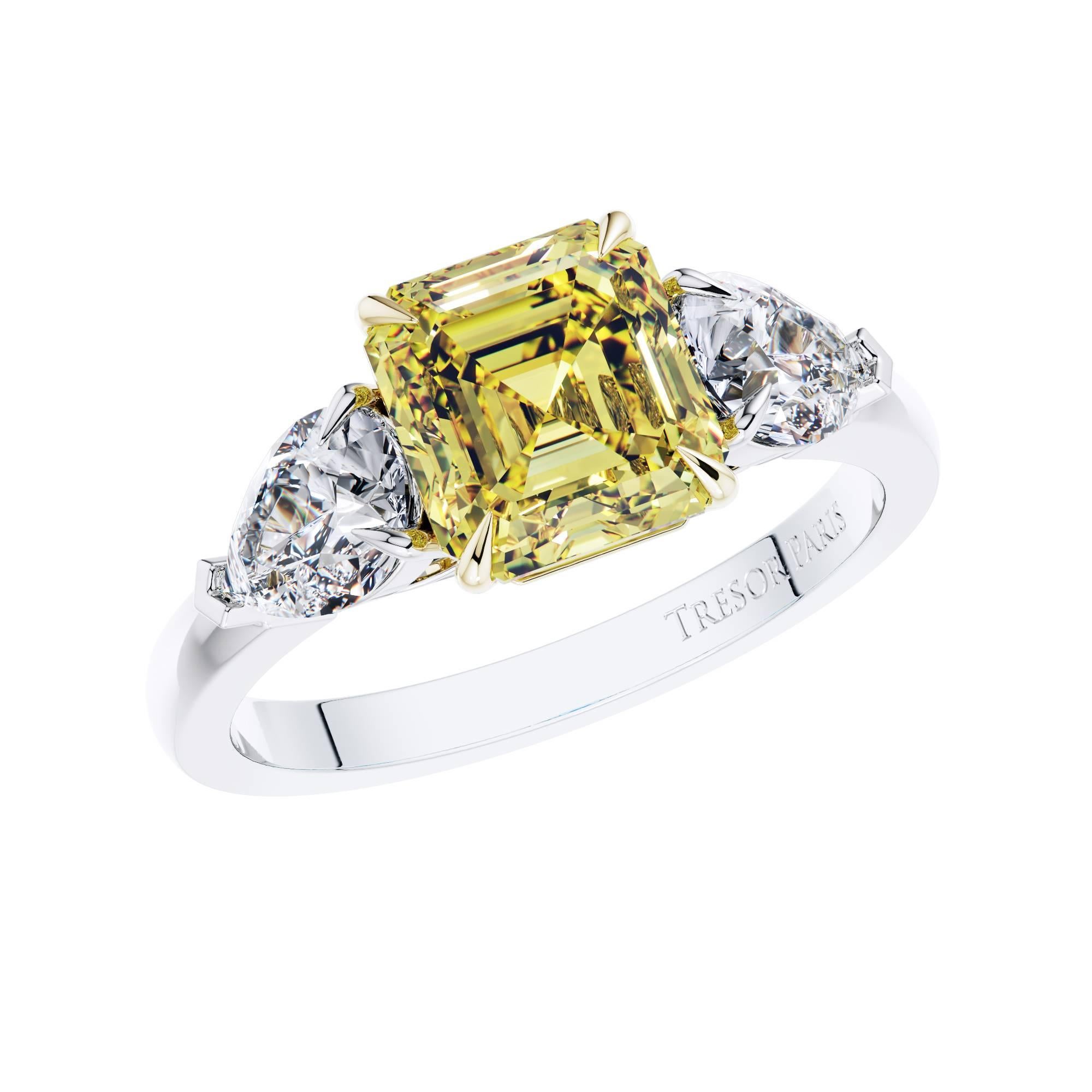 This spectacularly rare GIA Certified Asscher Cut and Pear Shape 3 stone Diamond Engagement ring set in Platinum will suit the modern bride, with 2.19 Carat Asscher Cut Fancy Vivid Yellow VS1 Diamond in the center and 2 GIA Certified Pear Shape