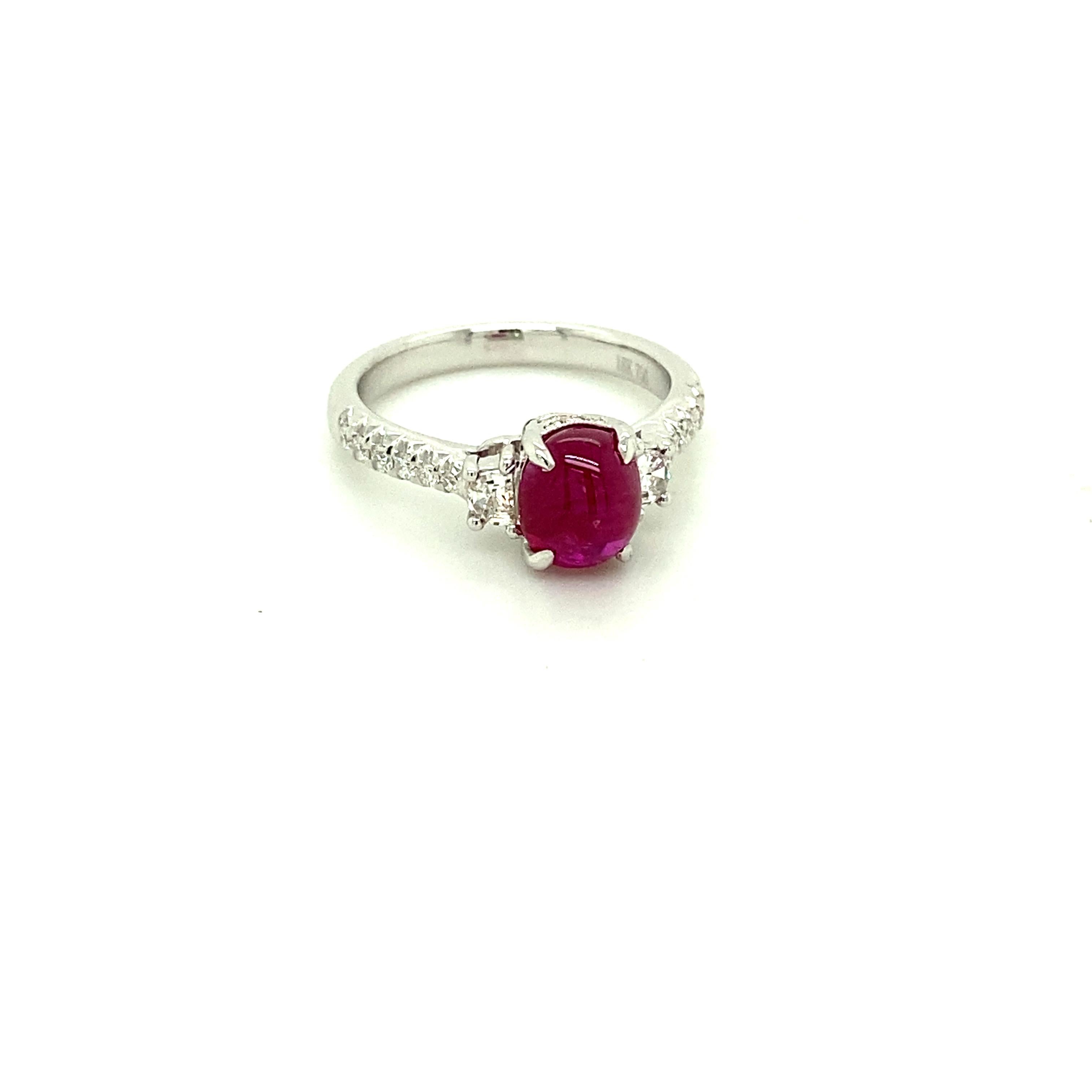2.19 Carat GRS Certified Unheated Burmese Ruby Cabochon and Diamond Gold Ring:  

A beautiful ring, it features a rare GRS certified 2.19 carat unheated Burmese ruby cabochon with baguette white diamonds on both sides of the ruby weighing 0.23