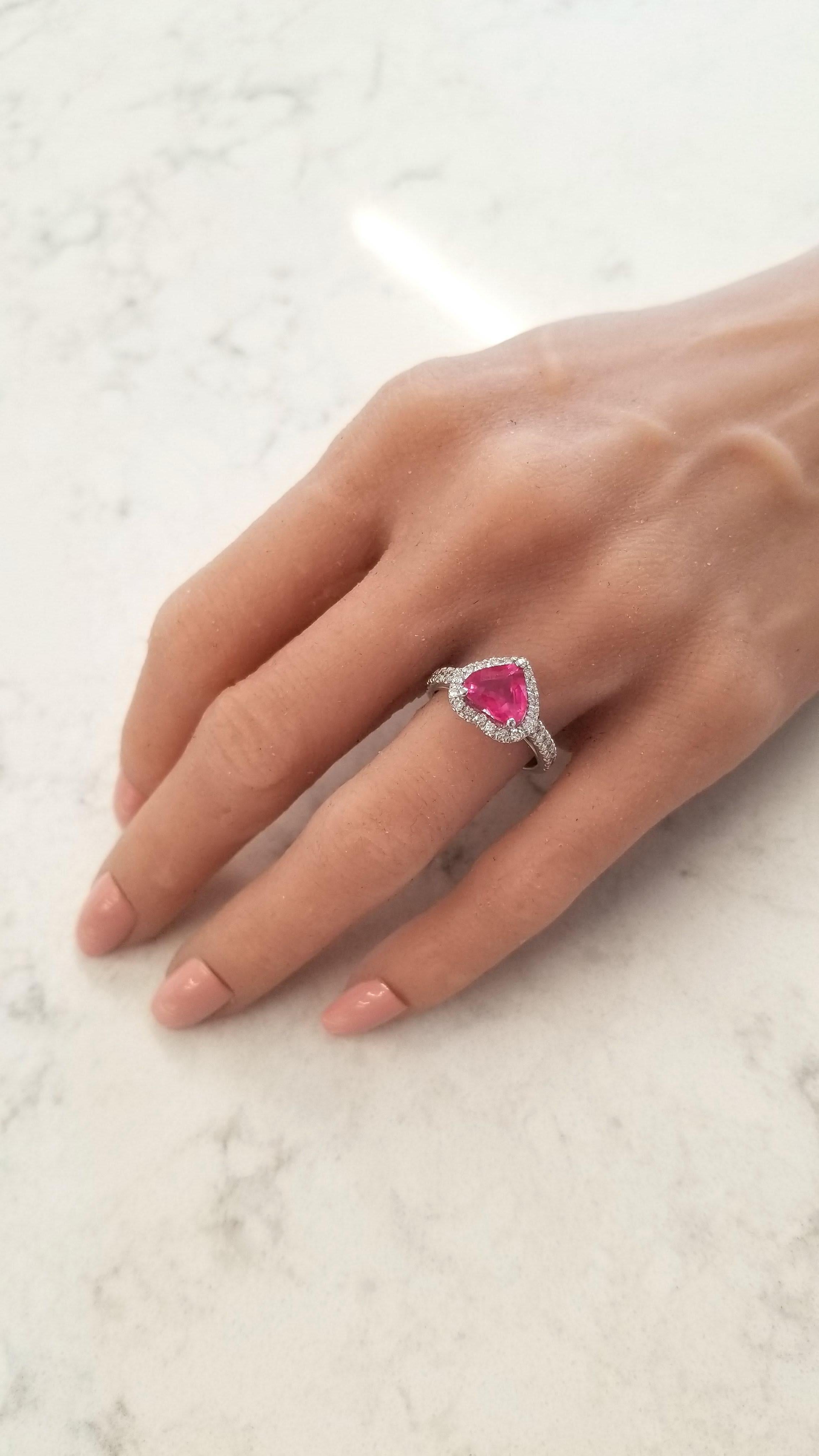 This is a red heart-shaped natural ruby weighing 2.19 carats with measurements of 9X8mm. This gem source is Thailand; its shape is even; its color is red with a slight pink undertone. Its transparency and luster are excellent. A total of 30