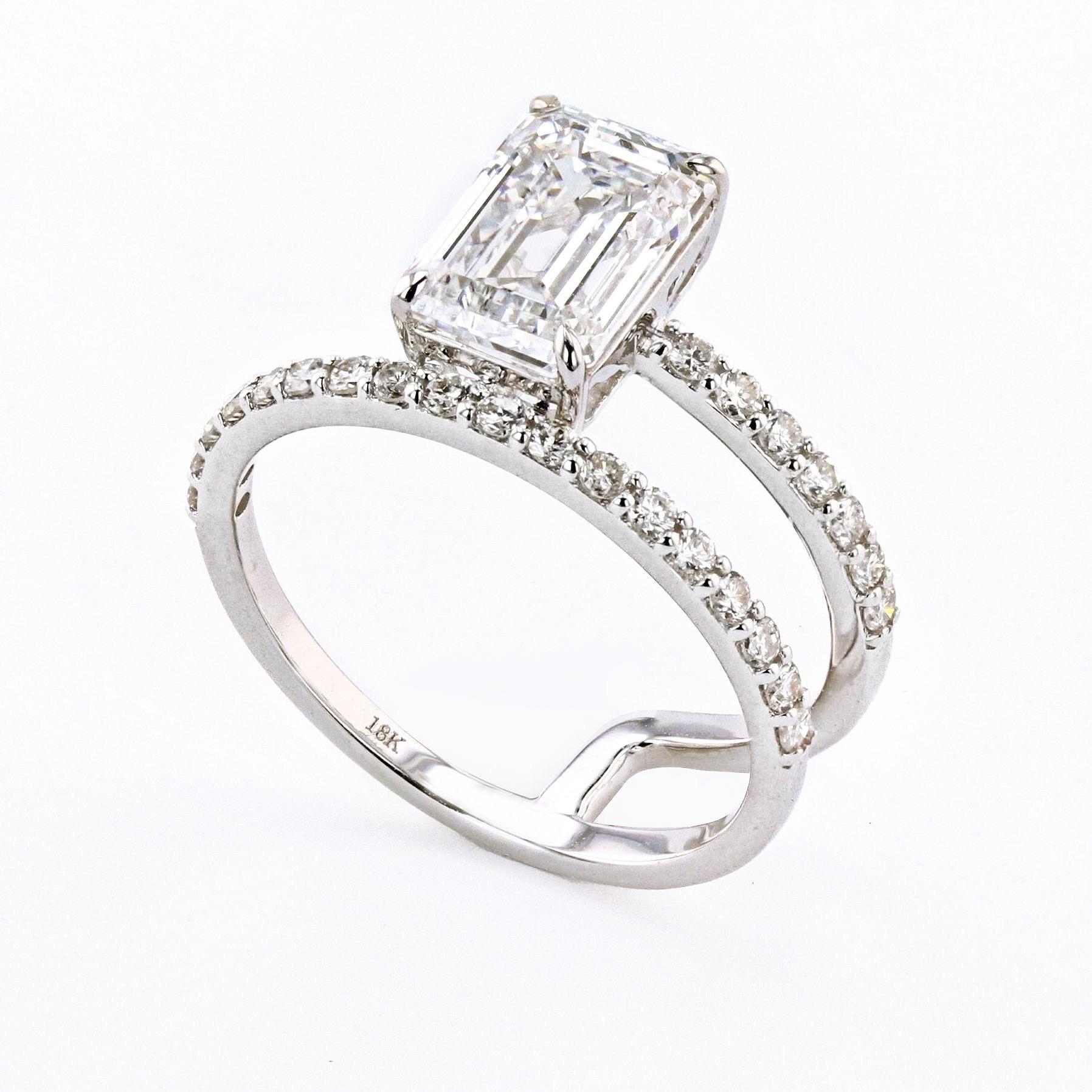 This emerald-cut lab-grown diamond is a type of diamond that is grown in a laboratory environment using advanced technology. The diamond has a rectangular shape with cut corners and a flat top, which gives it a distinctive and elegant