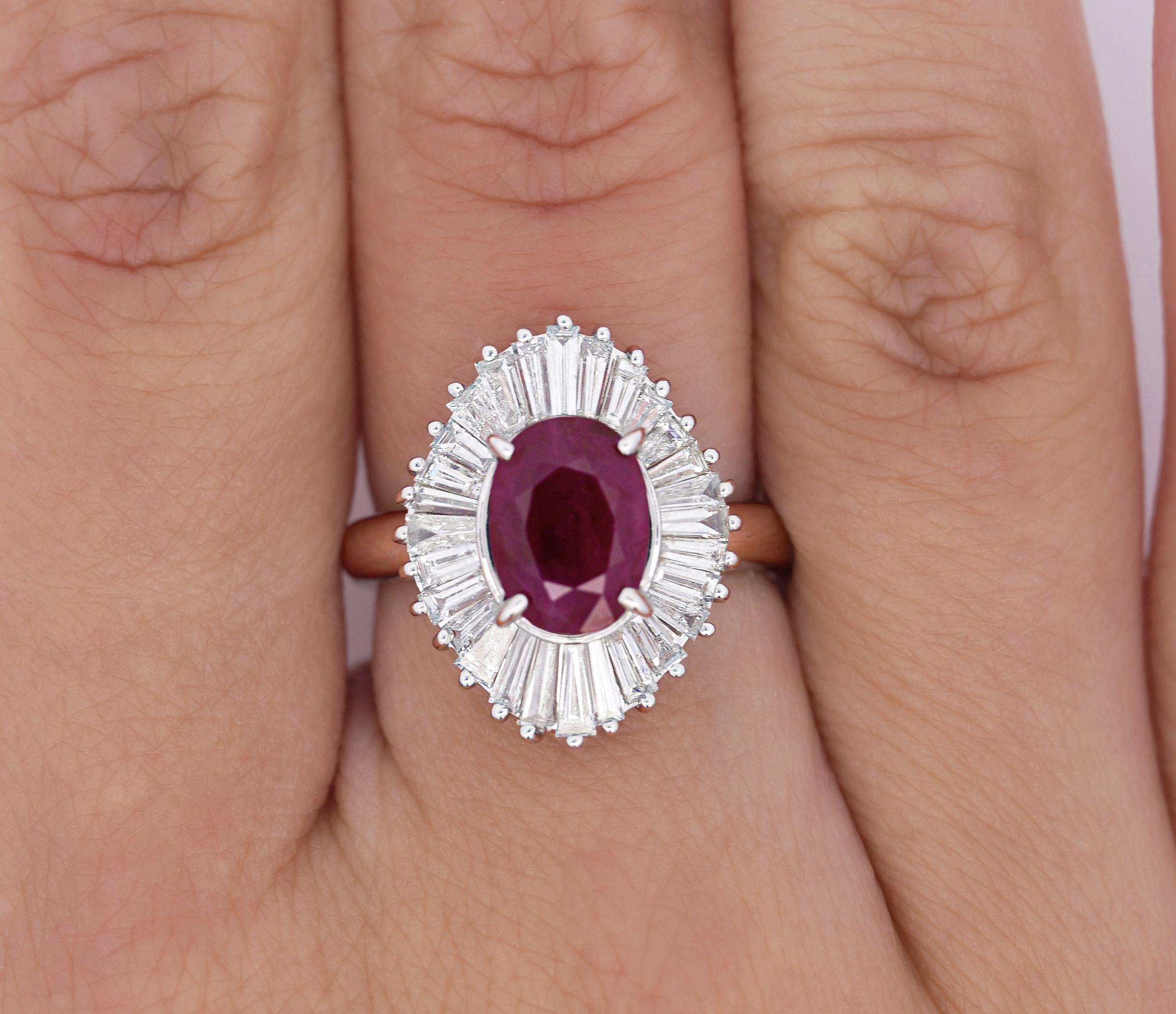 Oval Ruby and Diamond Platinum Ballerina Ring. 

Inspired by the shape of a ballerinas tutu, this ballerina ring features a natural oval cut ruby center stone. The ruby carries a weight of 2.19 carats and offers excellent clarity. The ruby is paired