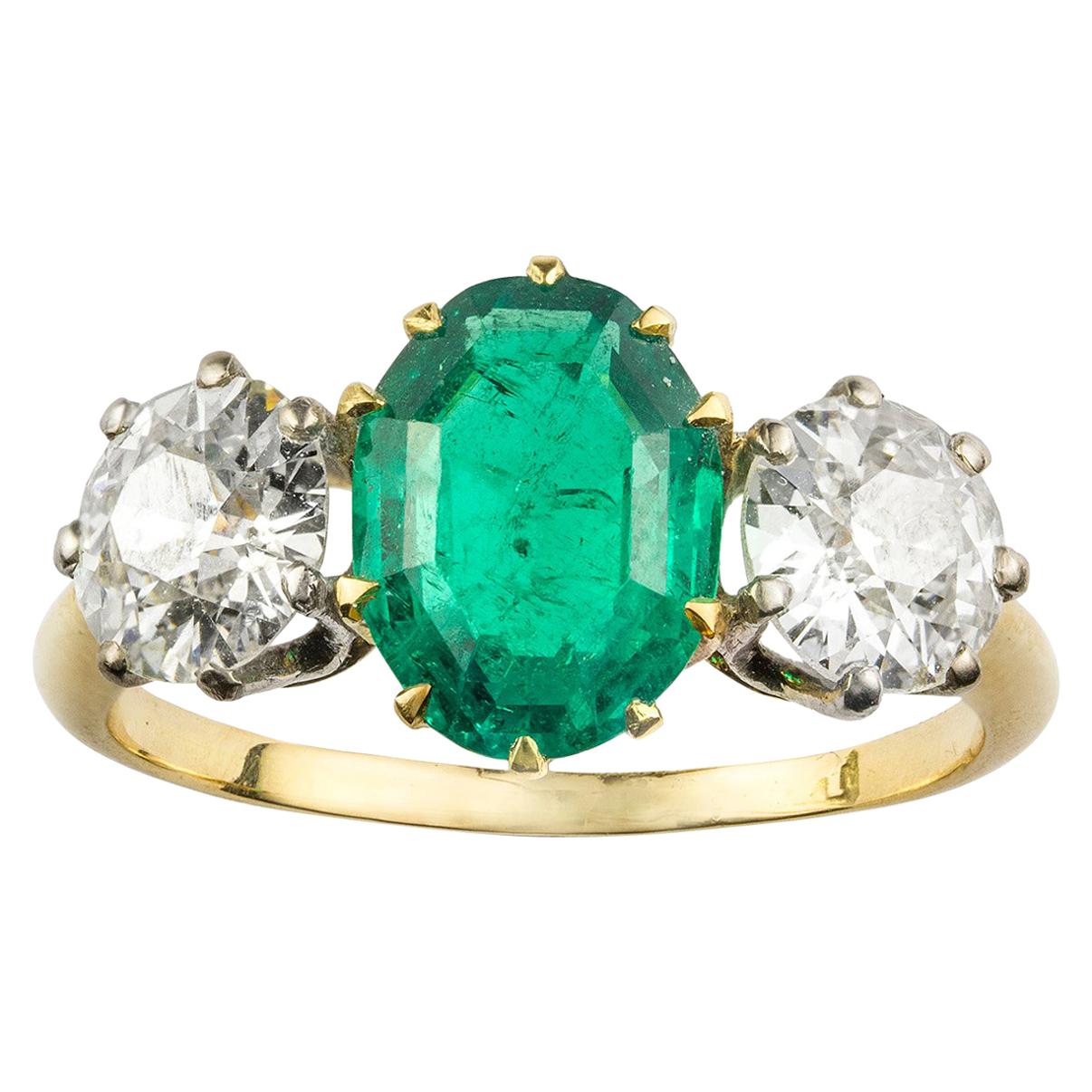 2.19 Carat Oval Emerald Diamond Gold Three-Stone Ring