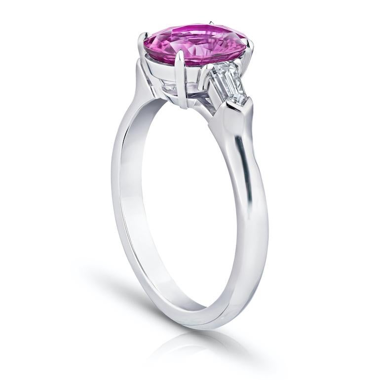 2.19 carat no heat pink oval sapphire with bullet shaped diamonds .33 carats set in a platinum ring
