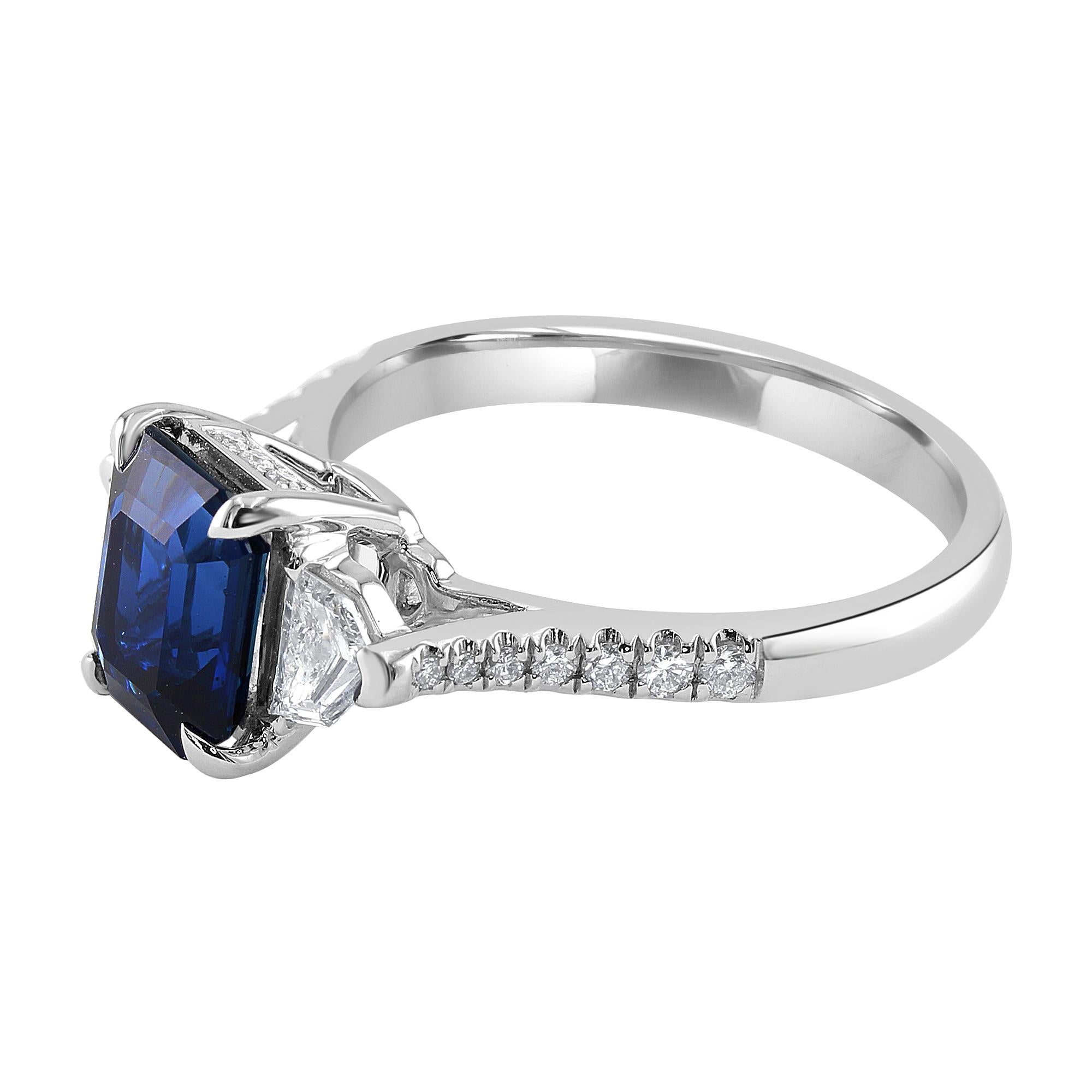 2.19 carat Emerald-cut Sapphire, set between two 0.28 carat epaulet diamonds.

Total weight round diamonds: 0.20 carat

Gorgeous one-of-a-kind blue sapphire engagement ring for a special lady looking for a unique look. This beauty may also be worn
