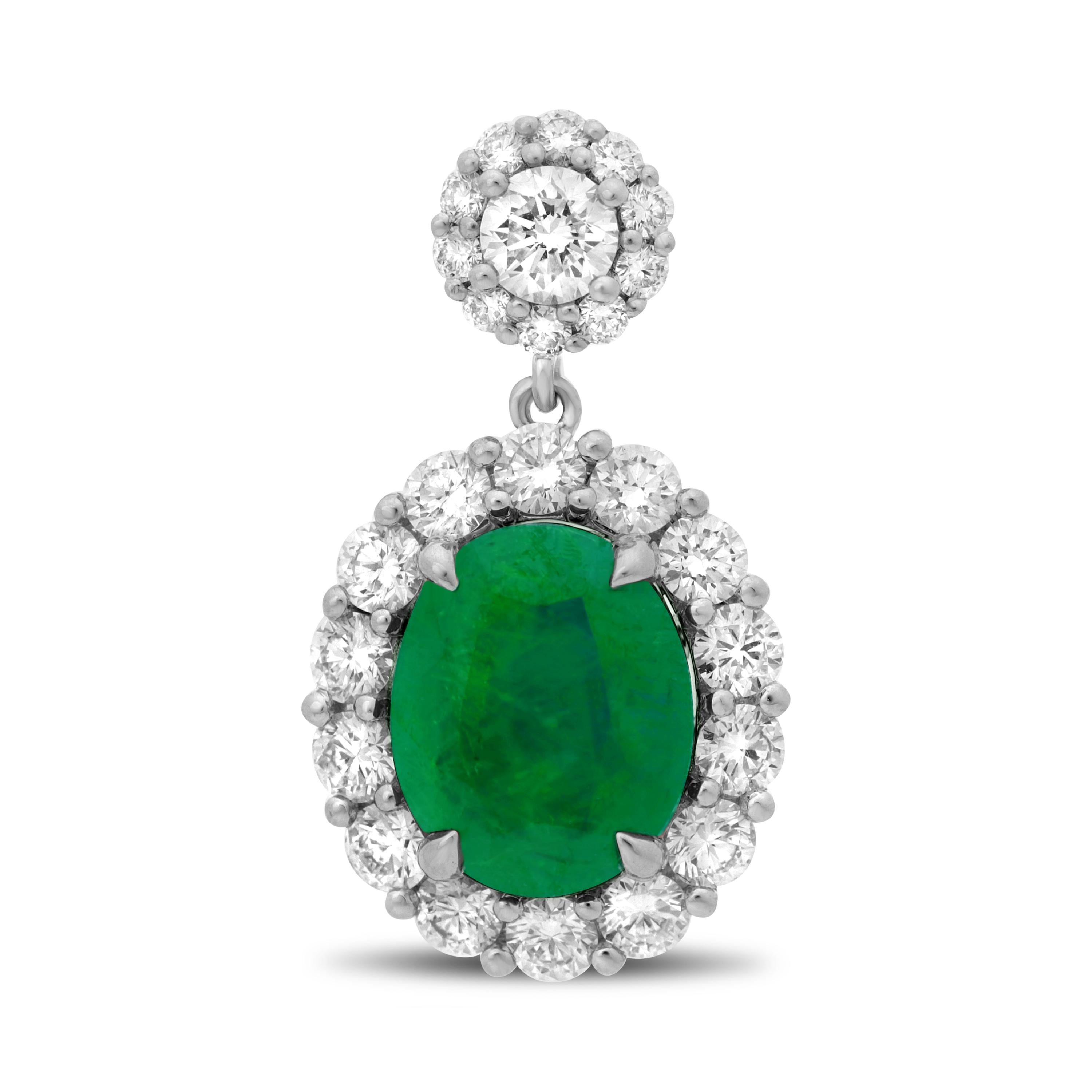 These classic drop earrings feature two elegant, oval cut, natural emeralds with a beautiful deep green color and 48 accent diamonds that total just over one carat. They are crafted from 18 karat white gold. 

Emeralds = oval, 2.19 carats 
Diamonds