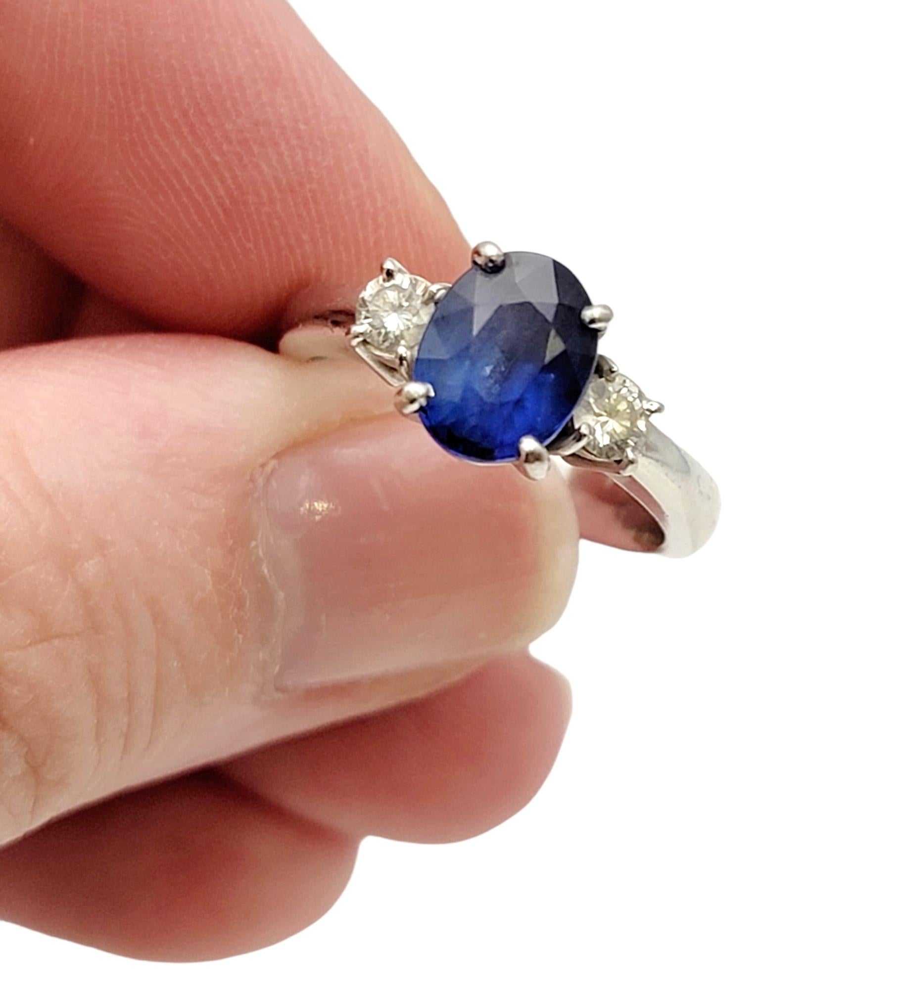 2.19 Carats Total Oval Natural Blue Sapphire and Round Diamond Three Stone Ring For Sale 5