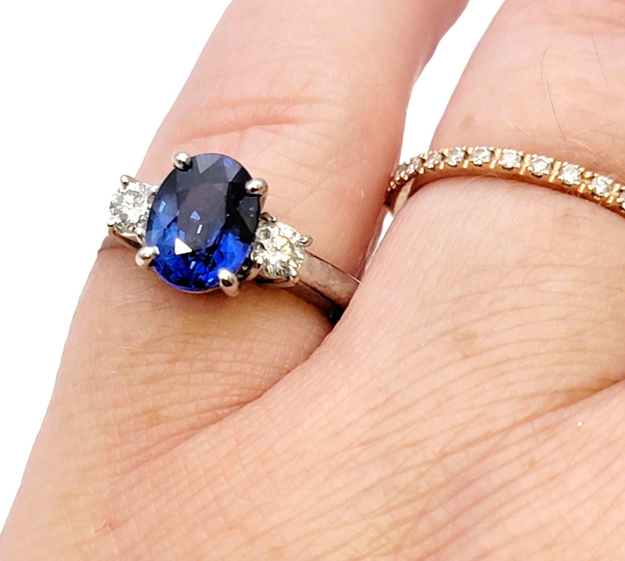 2.19 Carats Total Oval Natural Blue Sapphire and Round Diamond Three Stone Ring For Sale 6