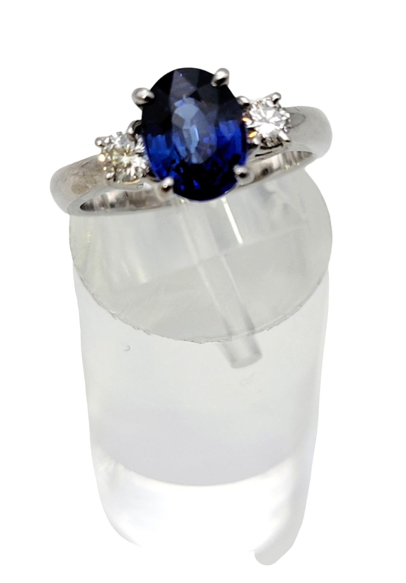 2.19 Carats Total Oval Natural Blue Sapphire and Round Diamond Three Stone Ring For Sale 2