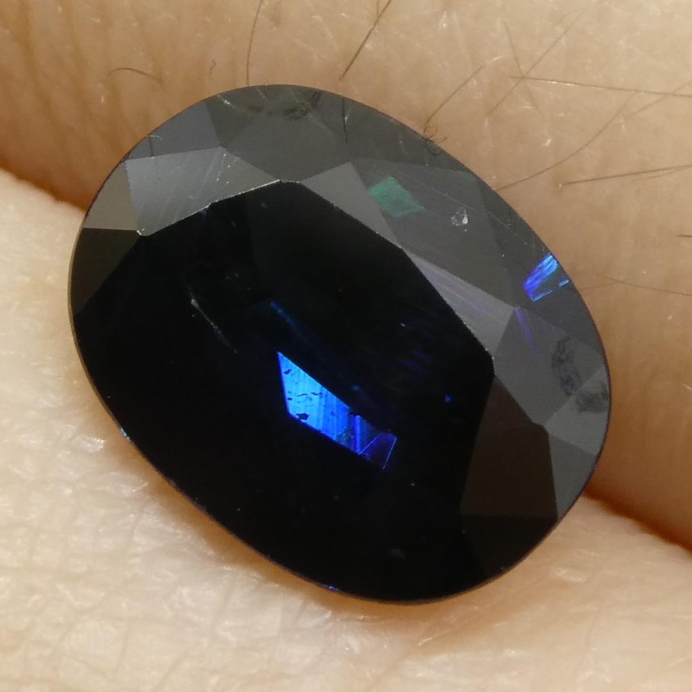 Description: 
One Loose Blue Sapphire  
Report Number: GT13412801  
Weight: 2.19 cts  
Measurements: 9.04x6.91x4.01 mm  
Shape: Oval  
Cutting Style Crown: Mixed Cut  
Cutting Style Pavilion: Mixed Cut   
Transparency: Transparent  
Clarity: Very