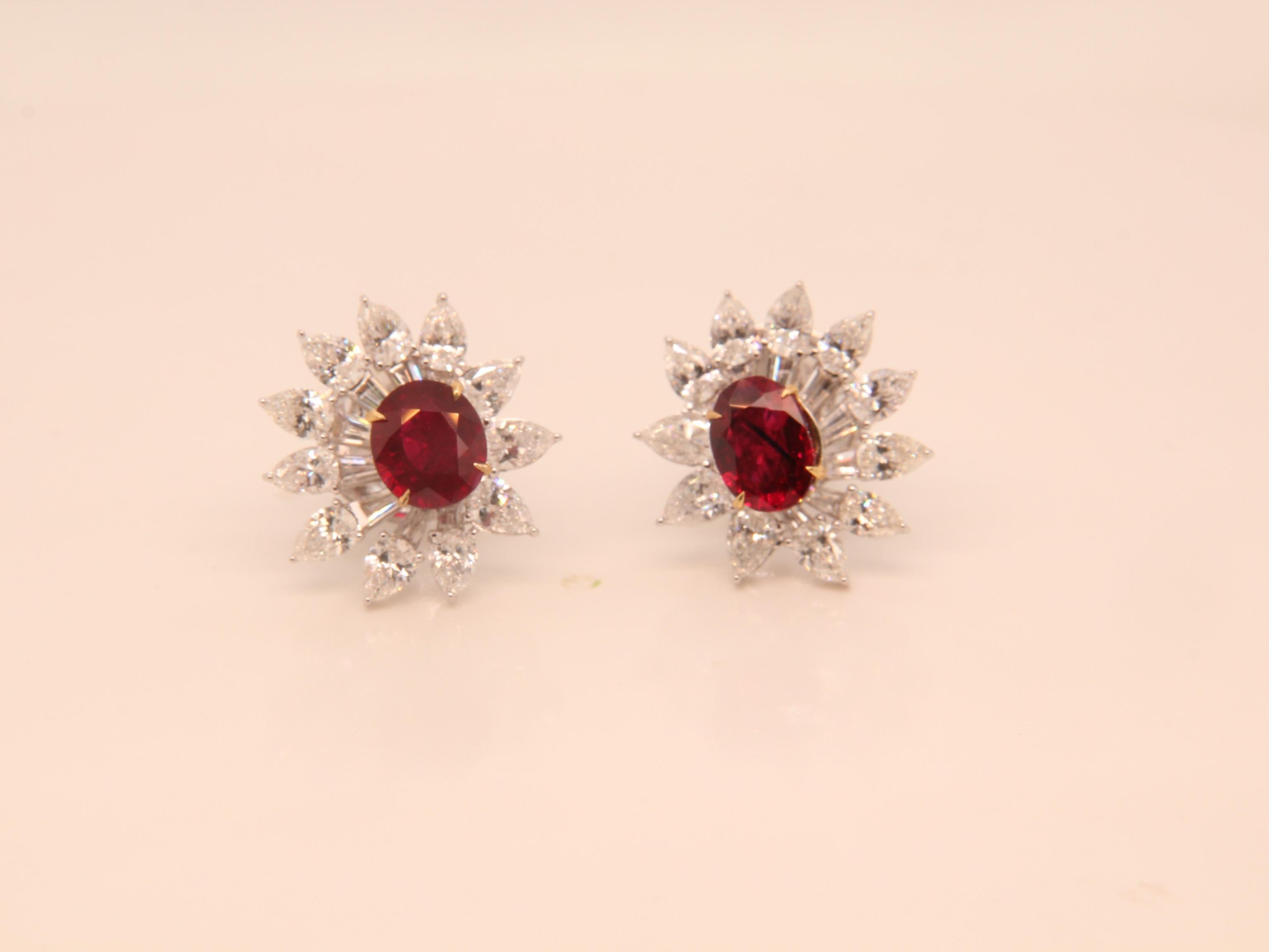 A brand new ruby and diamond earring by Rewa. The Burmese 'Pigeon Blood' ruby weigh 1.19 and 1.00 carat each and they are both certified by Gem Research Swisslab (GRS). The rubies are surrounded by 2.94 carat diamonds studded on 18k white gold 6.16