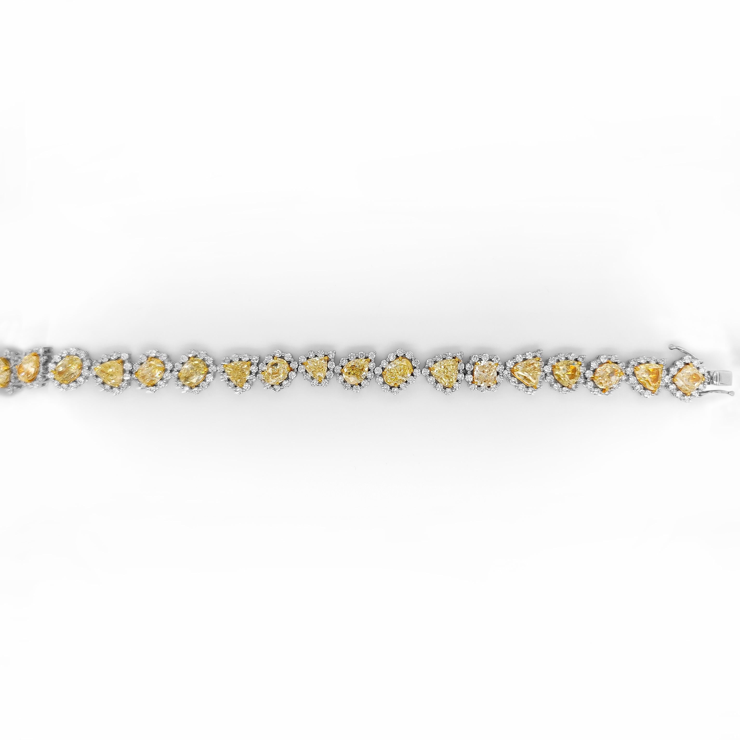215 Fancy Yellow and White Diamonds: 21.91 Carats
Metal: 18K White Gold, 20.10 Grams
