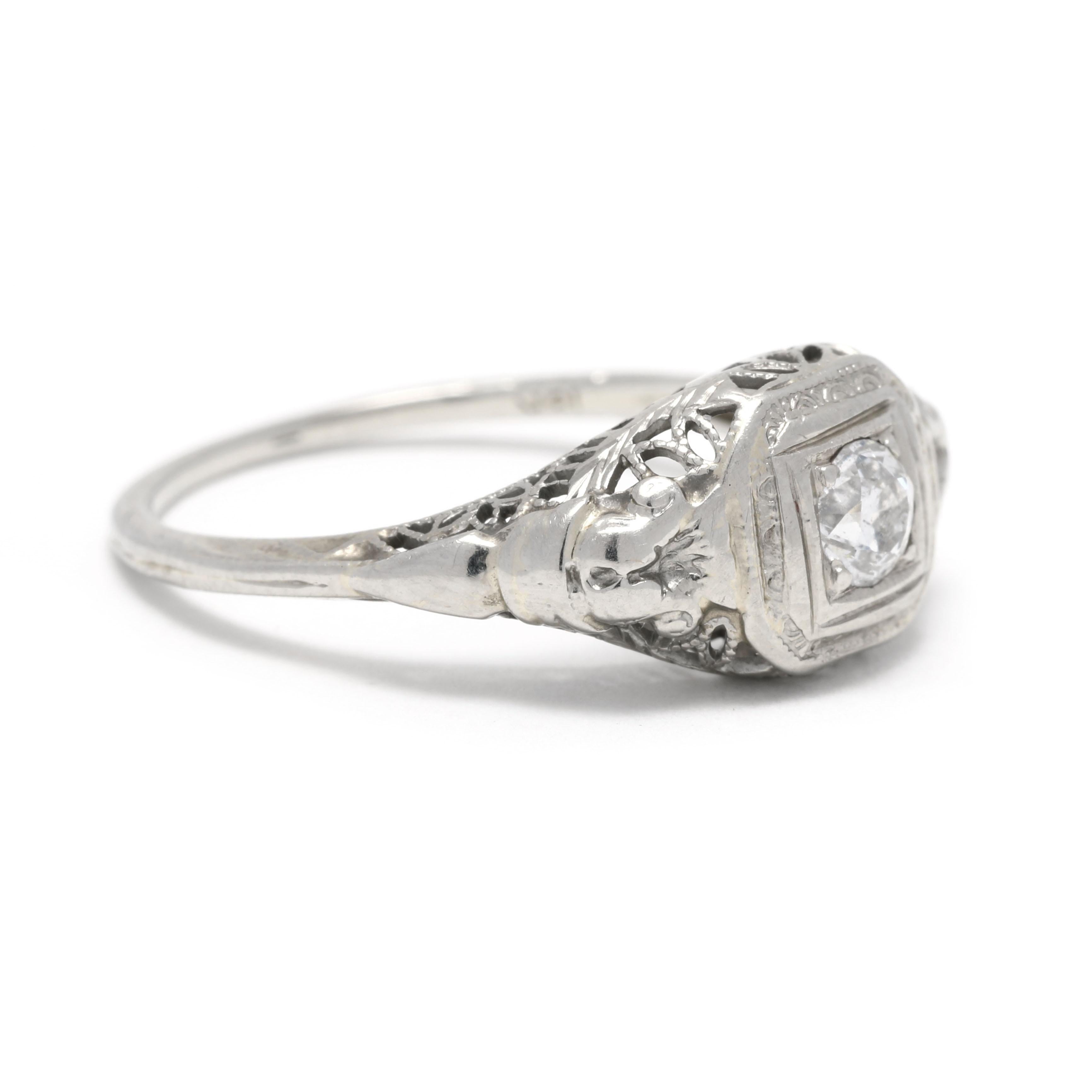 This stunning Art Deco diamond filigree engagement ring is crafted in 18K white gold and features 0.21 carats of dazzling diamonds. The intricate filigree detailing showcases a gorgeous floral design, making it the perfect choice for any romantic