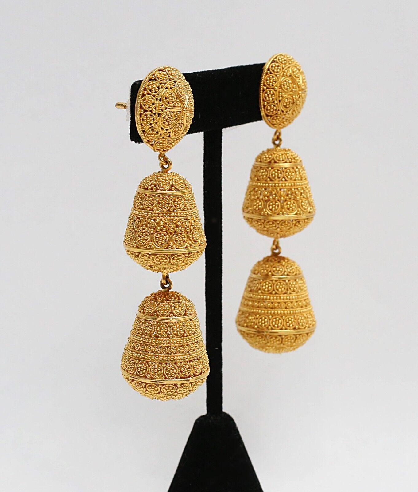This exquisite pair of dangle earrings are a must have for any jewelry collection. These three tier dangle earrings are crafted from 21k solid yellow gold with a friction post and tension backing (also known as push back). Vibrant and rich in color,