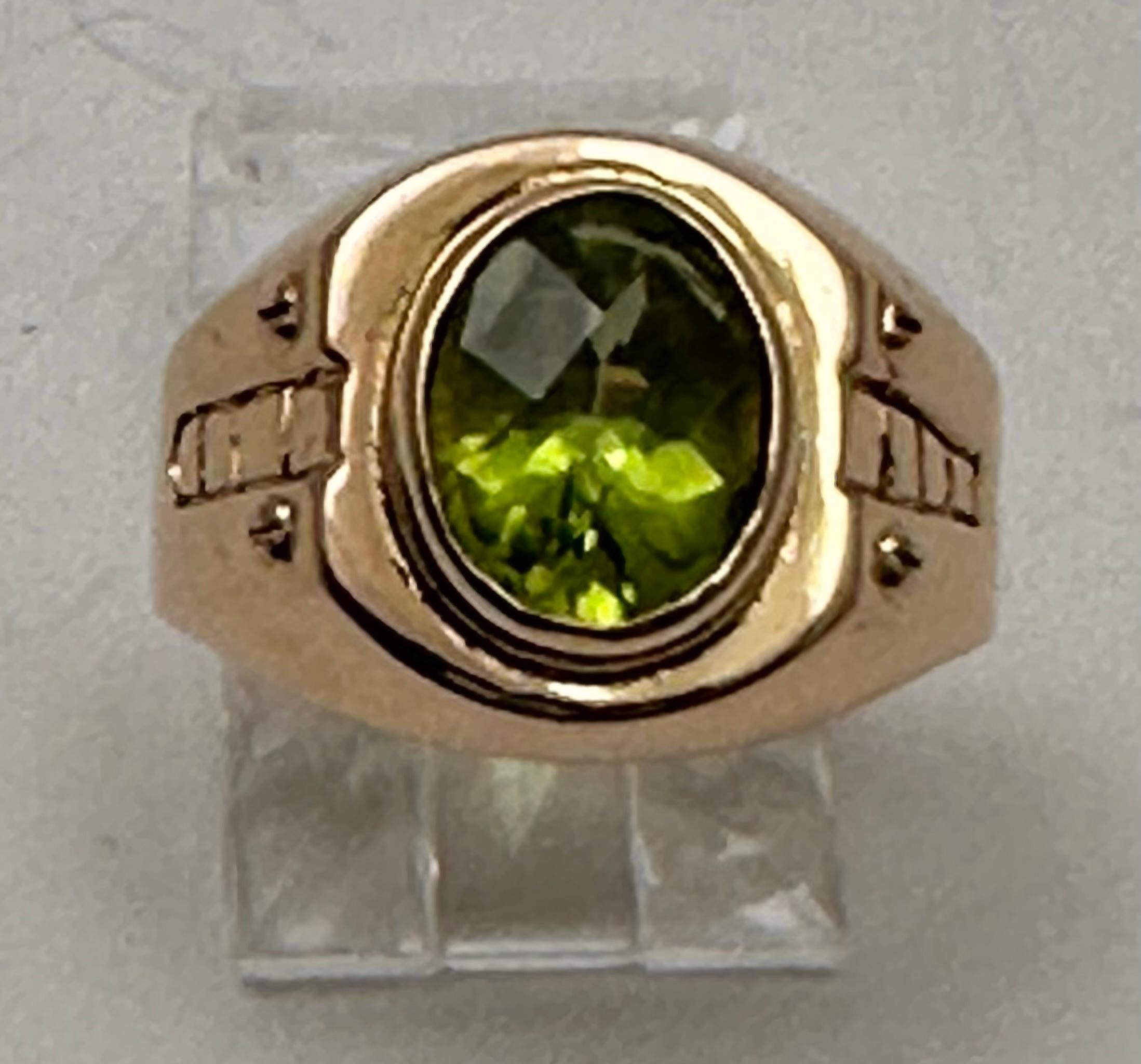 For sale is a beautiful handmade 21kt yellow gold ring with an oval peridot stone measuring 8mm x 9mm. The stone is a lovely green color and set securely in a bezel. The ring is size 5 3/4 and can be resized if needed. This fine jewelry piece is