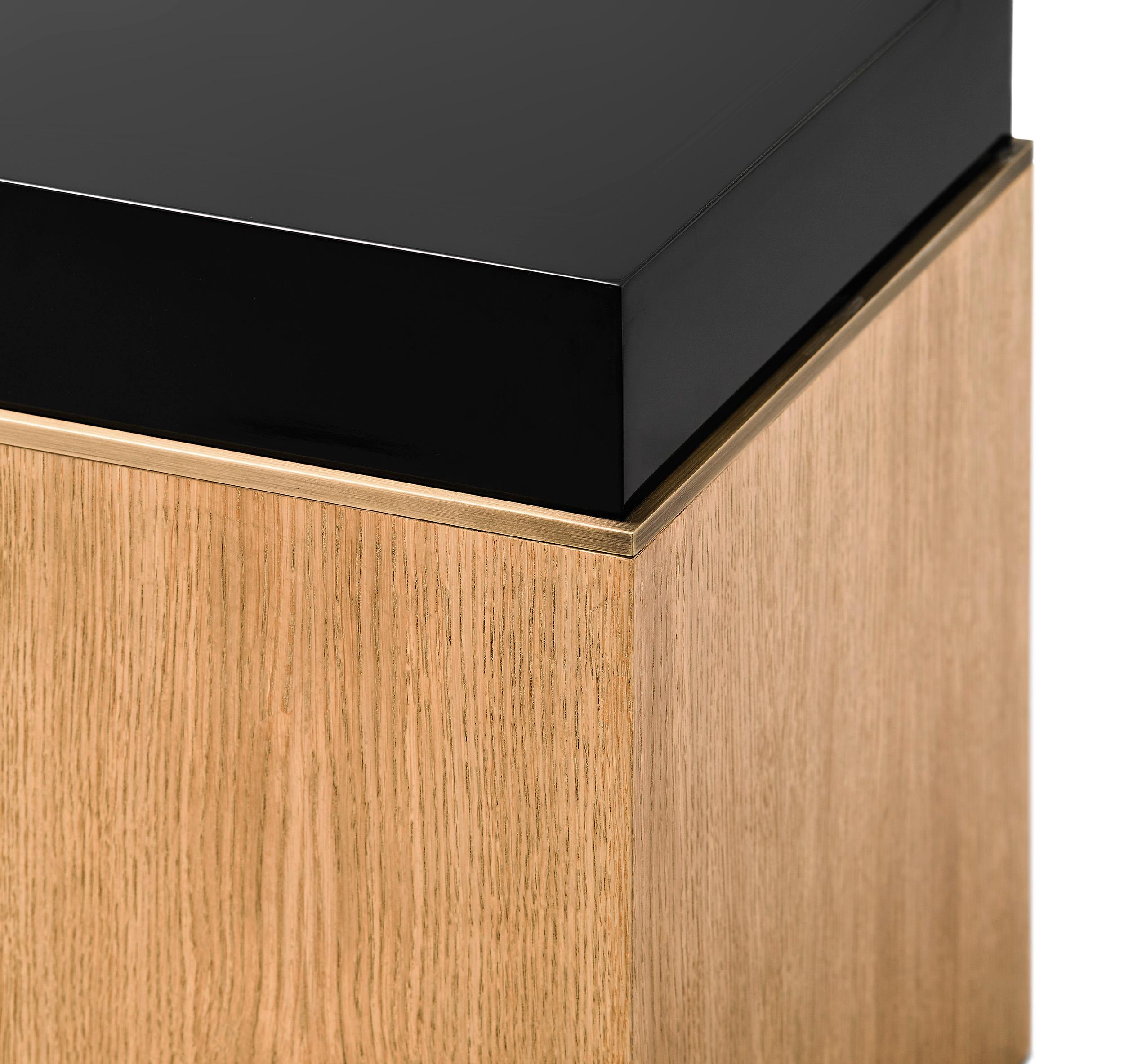 Block Pedestal, Limed Oak and Brass Details, Handcrafted in Portugal by Duistt

The Block Pedestal is a strong masculine piece composed of clean lines and allowing a variety of finishes. The black limed oak creates a contrast against the high gloss