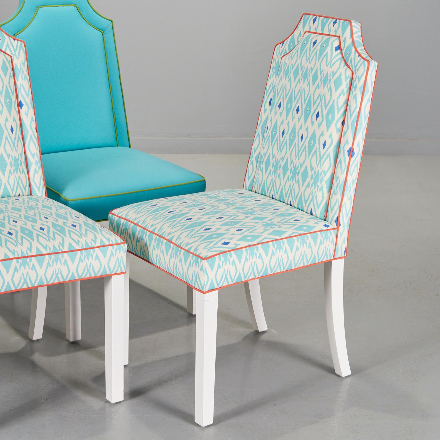 21st c., (2) pairs of colorfully upholstered Parsons side chairs, two in turquoise with lime green piping, and two in blue Ikat style pattern with coral piping, each with shaped padded seat backs, on white lacquered legs, unmarked,