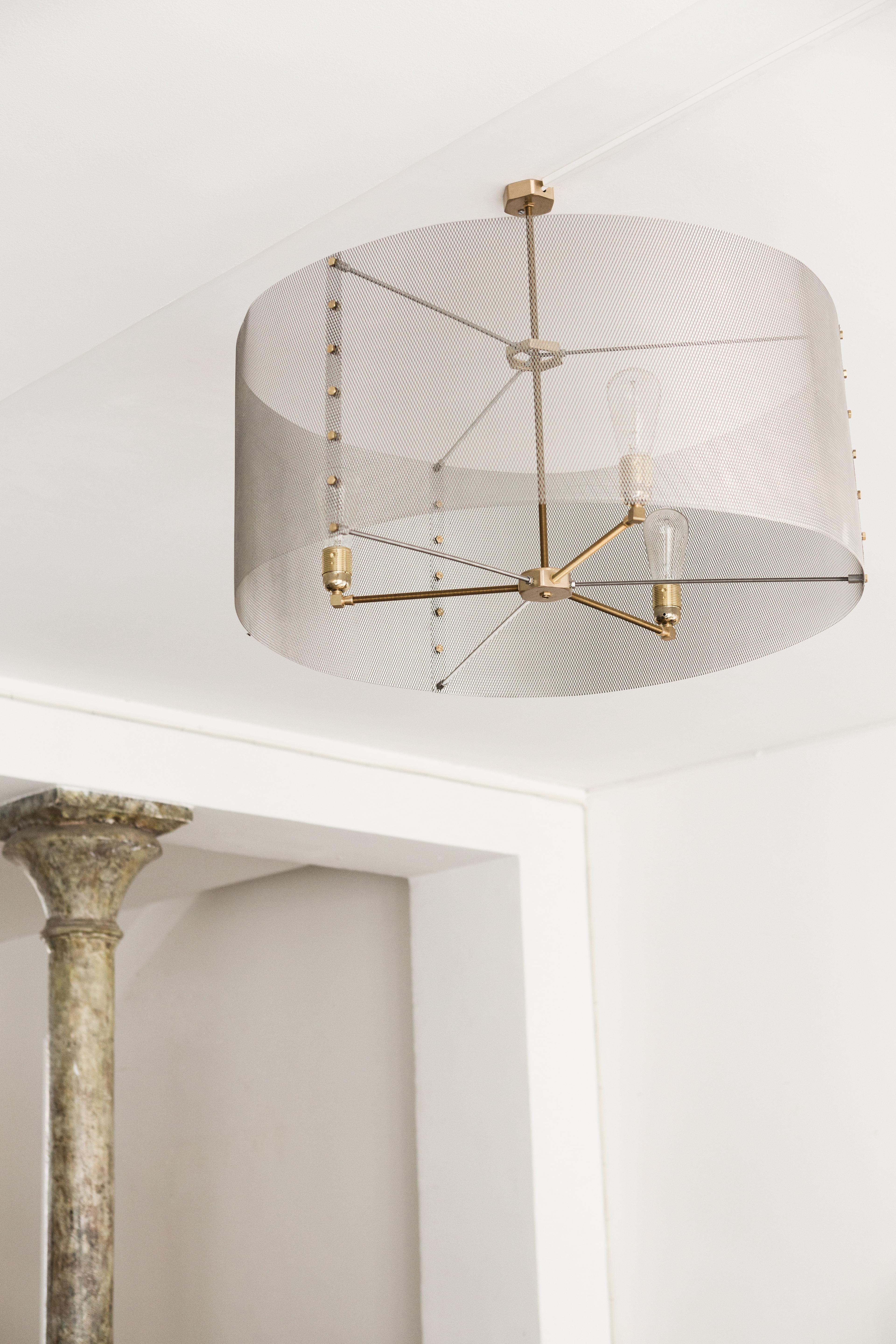 These Trapenard chandelier fit with elegance in a contemporary interior, refined in their lines. 
The golden expanded metal shade diffuses an intimate light. They will be perfect for a dinner table or a bar.
Comforting lights, with
