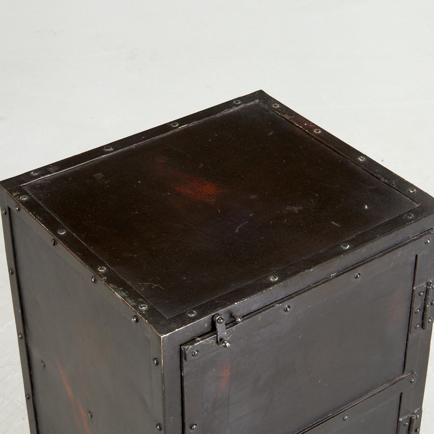 21st c., Butler Owen Industrial Side Cabinet, a single door iron cabinet, with interior shelf, in distressed black finish, unmarked. 

Evocative of a storage locker, this rugged side chest is an inspired addition to any loft space. Forged from iron