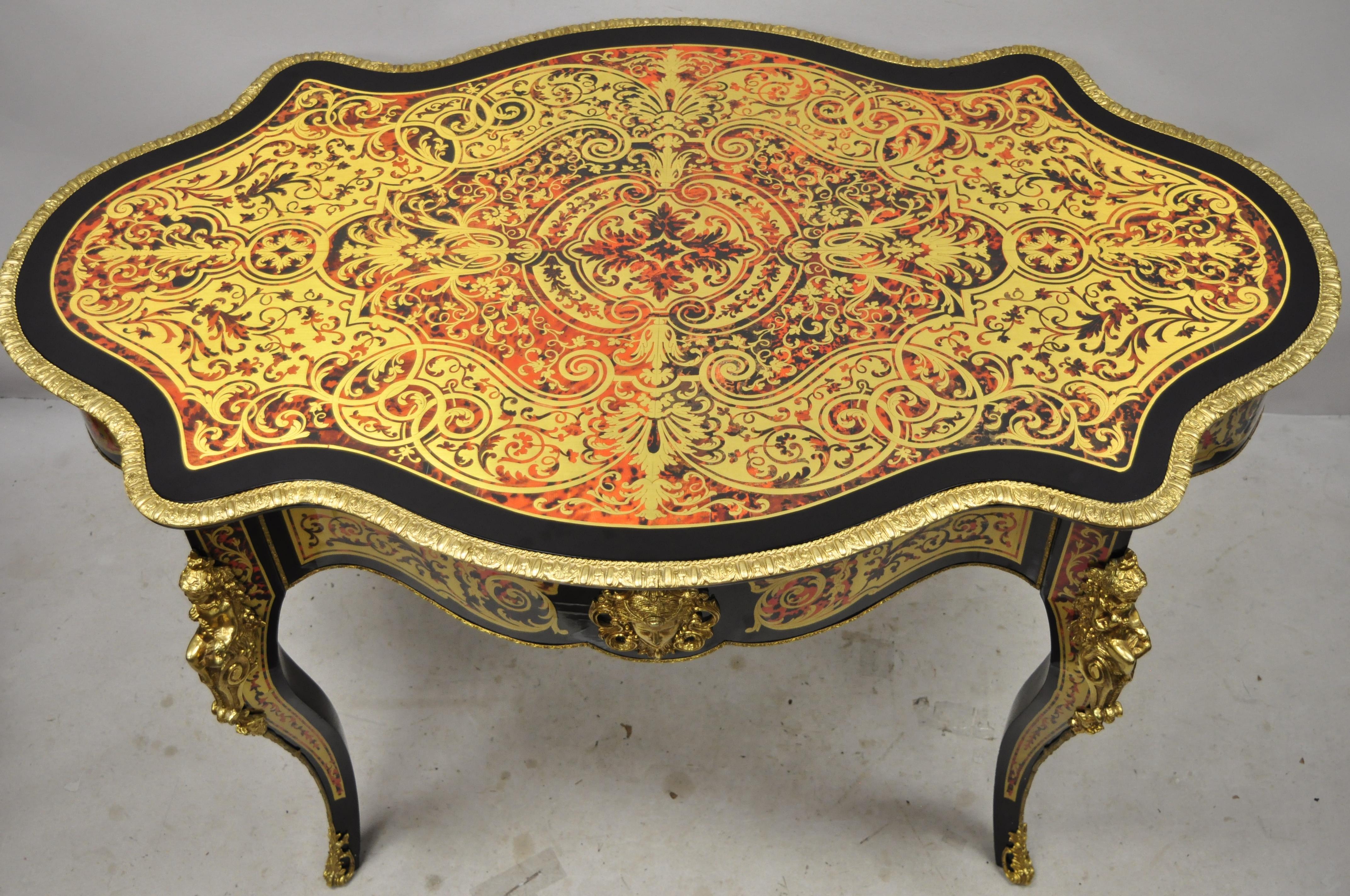 21st century Napoleon III French inlaid brass bronze boulle turtle top center table. Item features breathtaking brass/bronze boulle work inlay throughout including the stunning top, sides, and legs, figural bronze ormolu with maiden forms, black