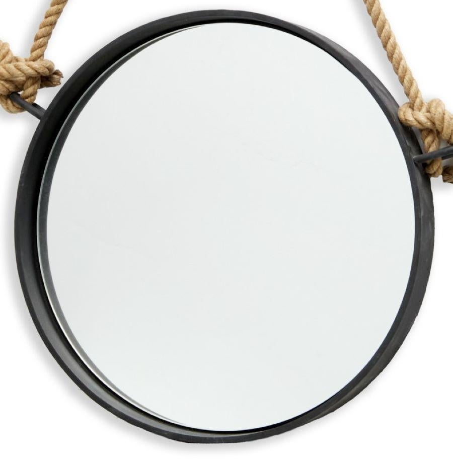 21st c., Restoration Hardware heavy oxidized black metal framed round form mirror, with a knotted jute rope hanger. The RH sticker label is attached to the back. The mirror weight is 64lbs. The mirror hangs securely from a bracket on the back panel