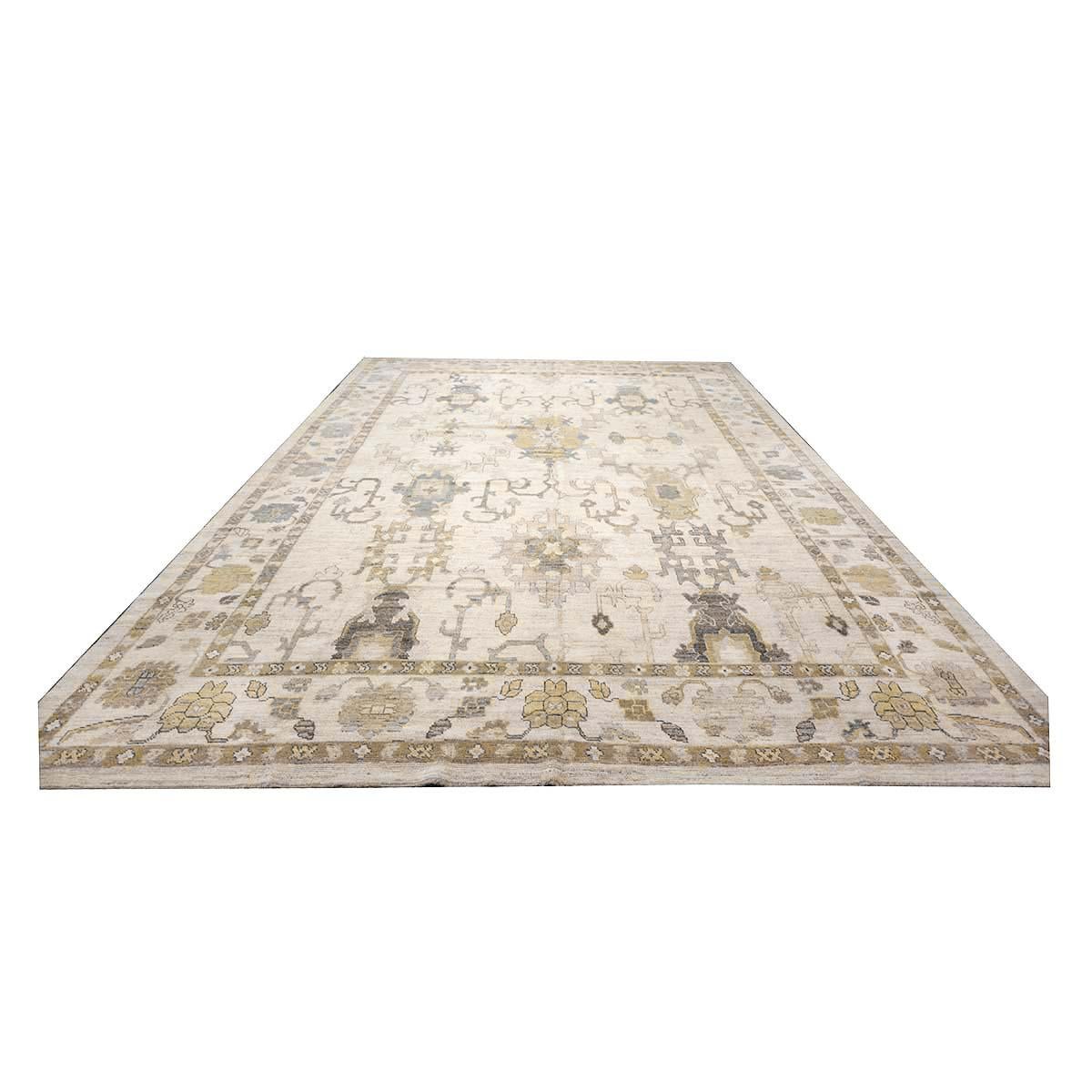   Ashly Fine Rugs presents a 21st-century Oversized Turkish Oushak 12x19 Handmade Area Rug. Oushak weavings began in a location just south of Istanbul, in a region that was to become the rugs namesake, Oushak. Although nomads first produced the rugs