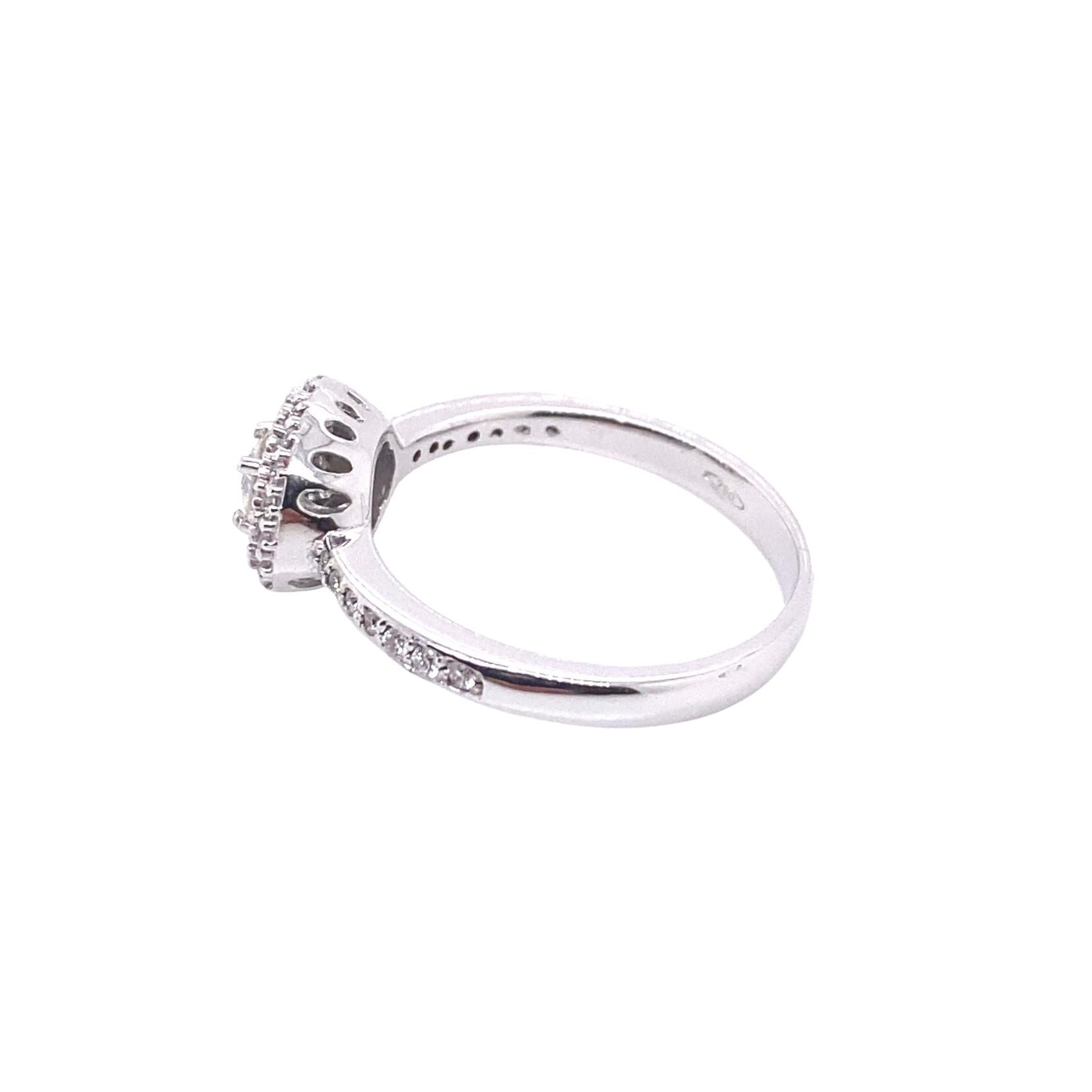 This lovely ring is suitable for any occasion. Masterfully created entirely by hand from 18-karat white gold and brilliant round-cut G-VS white diamonds.

The photographed ring is size 13 EU/6.5 US. It can be re-made in any ring size on request.