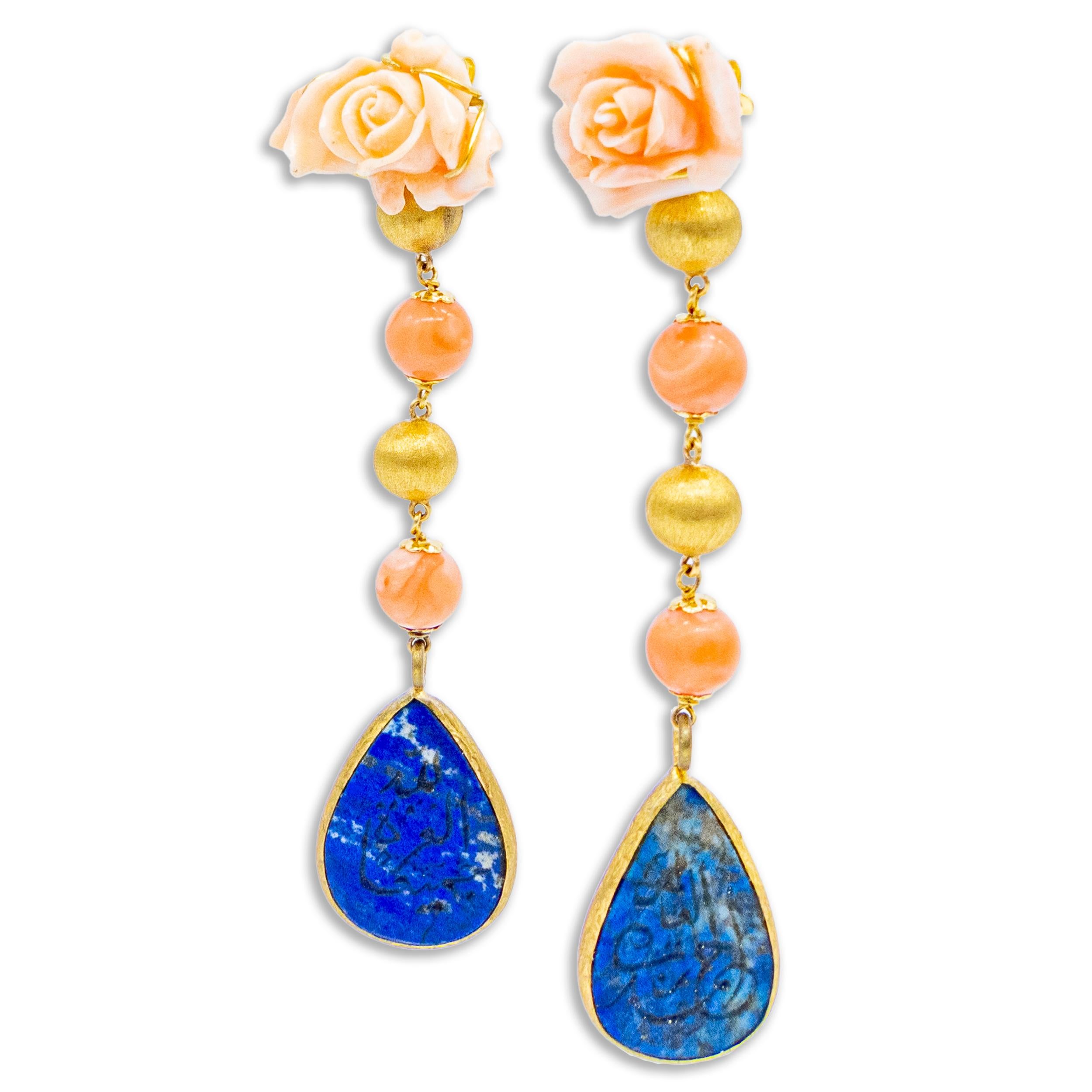 21st Century 18 Karat Gold Earrings Coral Roses Lapis Lazuli Arabic Calligraphy

18 Karat yellow gold earrings, angel skin coral carved in the shape of a rose, angel skin coral beads and antique piece of lapis lazuli with Arabic calligraphy covered
