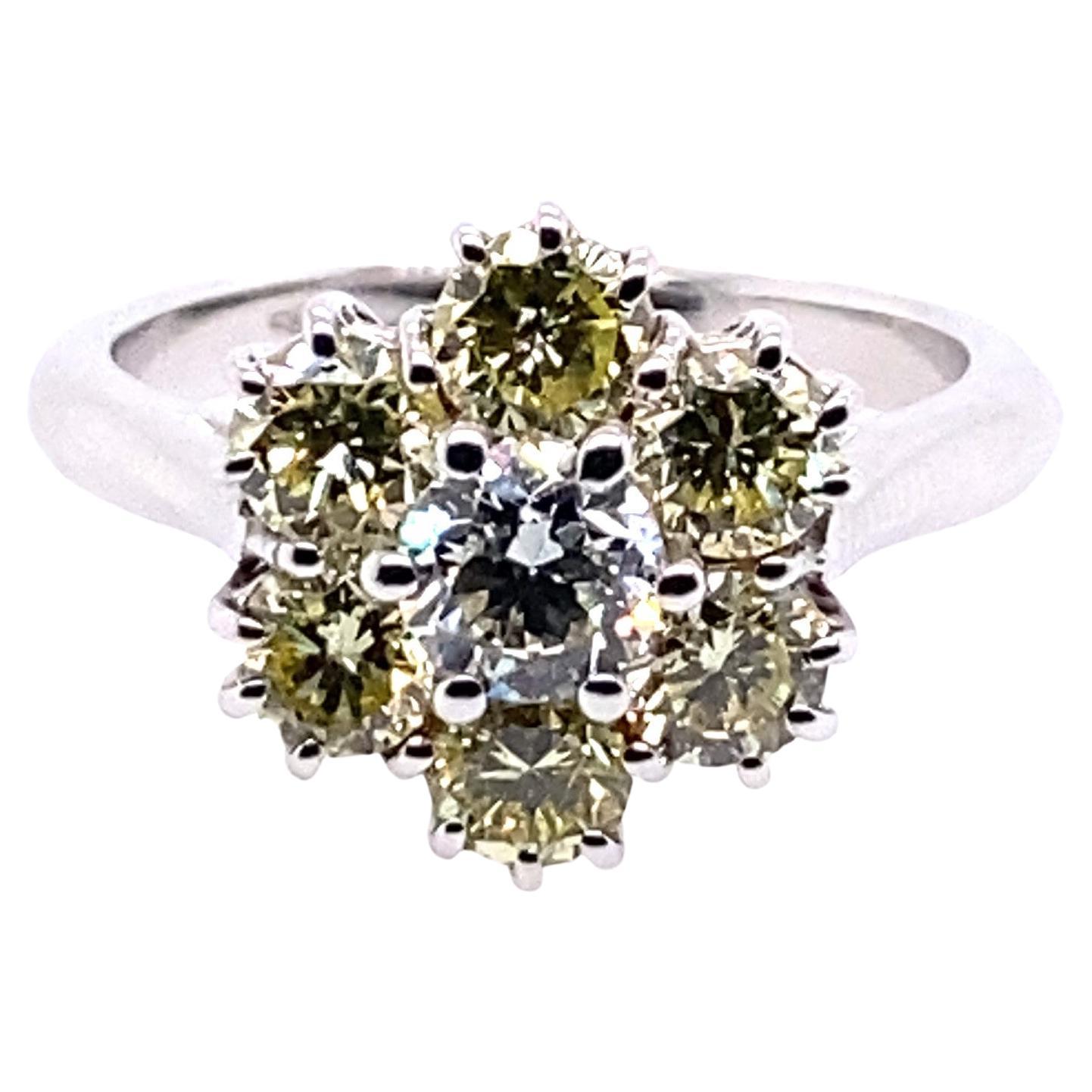 This magnificent ring is suitable for any occasion from cocktail to anniversary.  Masterfully created entirely by hand from 18-karat white gold, it contains 1.78-carats of white F/G VVS and VS (light colour fancy) yellow diamonds. The top of the