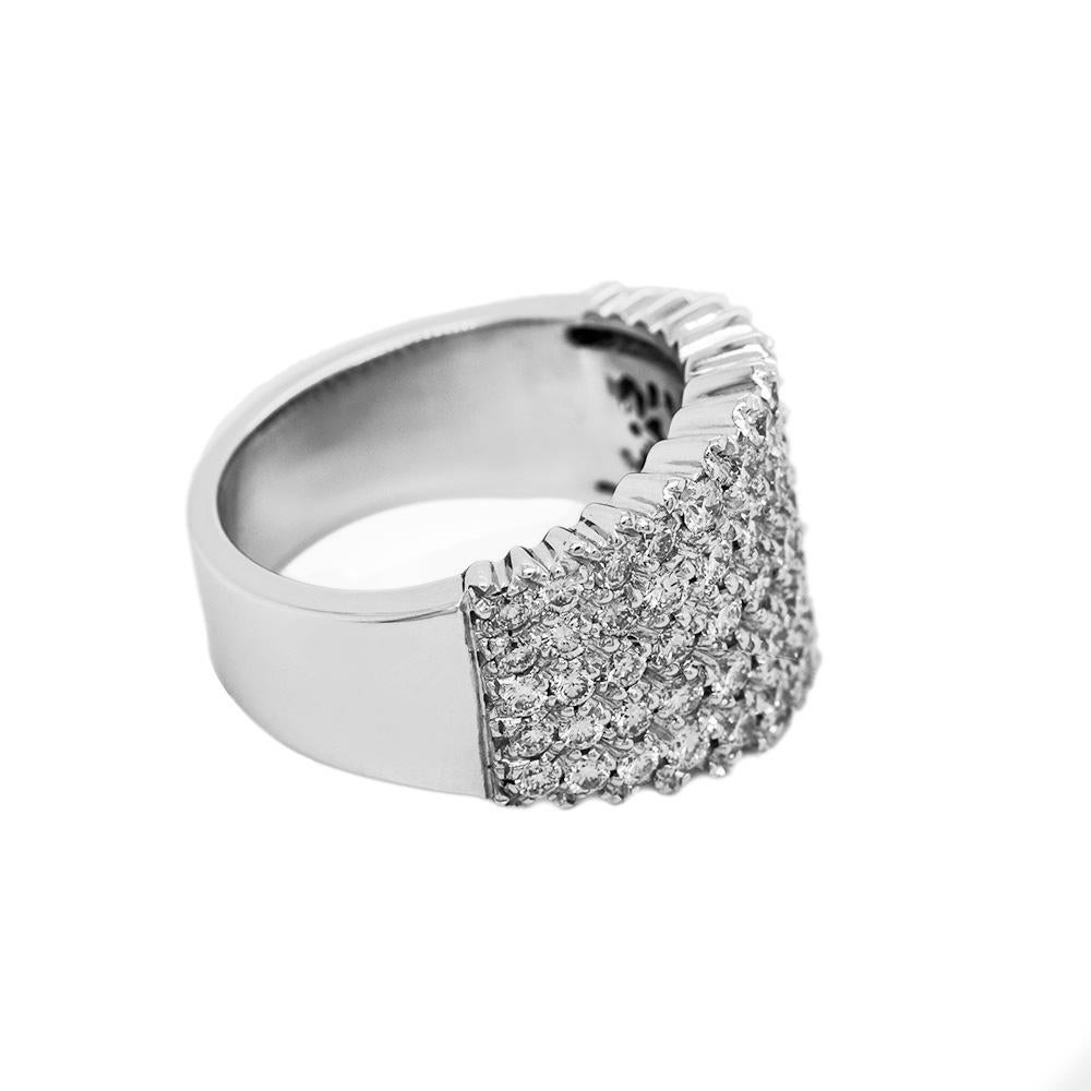 This 18-karat white gold and diamond cocktail ring is sleek and modern. It features 2.4 carats of brilliant round-cut white pavé diamonds set into white gold.  

Measuring 1.8 cm wide and weighing 11.1 grams, the photographed ring is a 12.5 EU/6.25