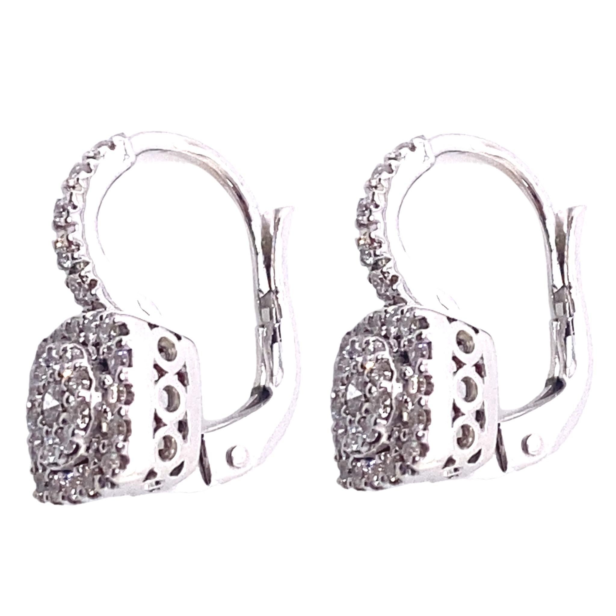 Introducing a timeless masterpiece that exudes elegance and sophistication - a pair of stunning white gold and diamond French-clip drop earrings. Impeccably crafted by skilled artisans, these earrings are a true testament to the artistry and