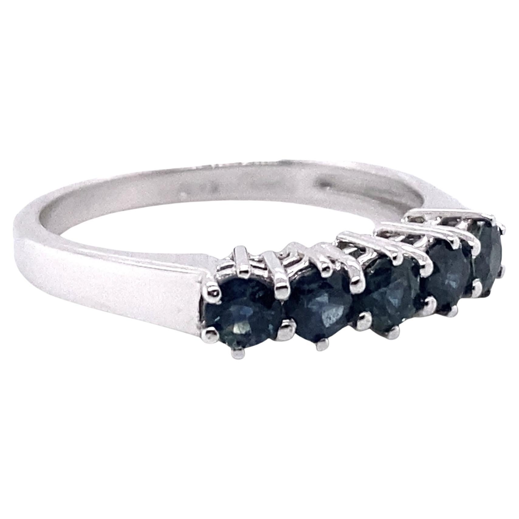 This ring has been masterfully created entirely by hand from 18-karat white gold and contains 5 single brilliant blue sapphires, weighing just under a carat.

The photographed ring is an EU 15/US 7.50 ring size. It can be re-made in any ring size on