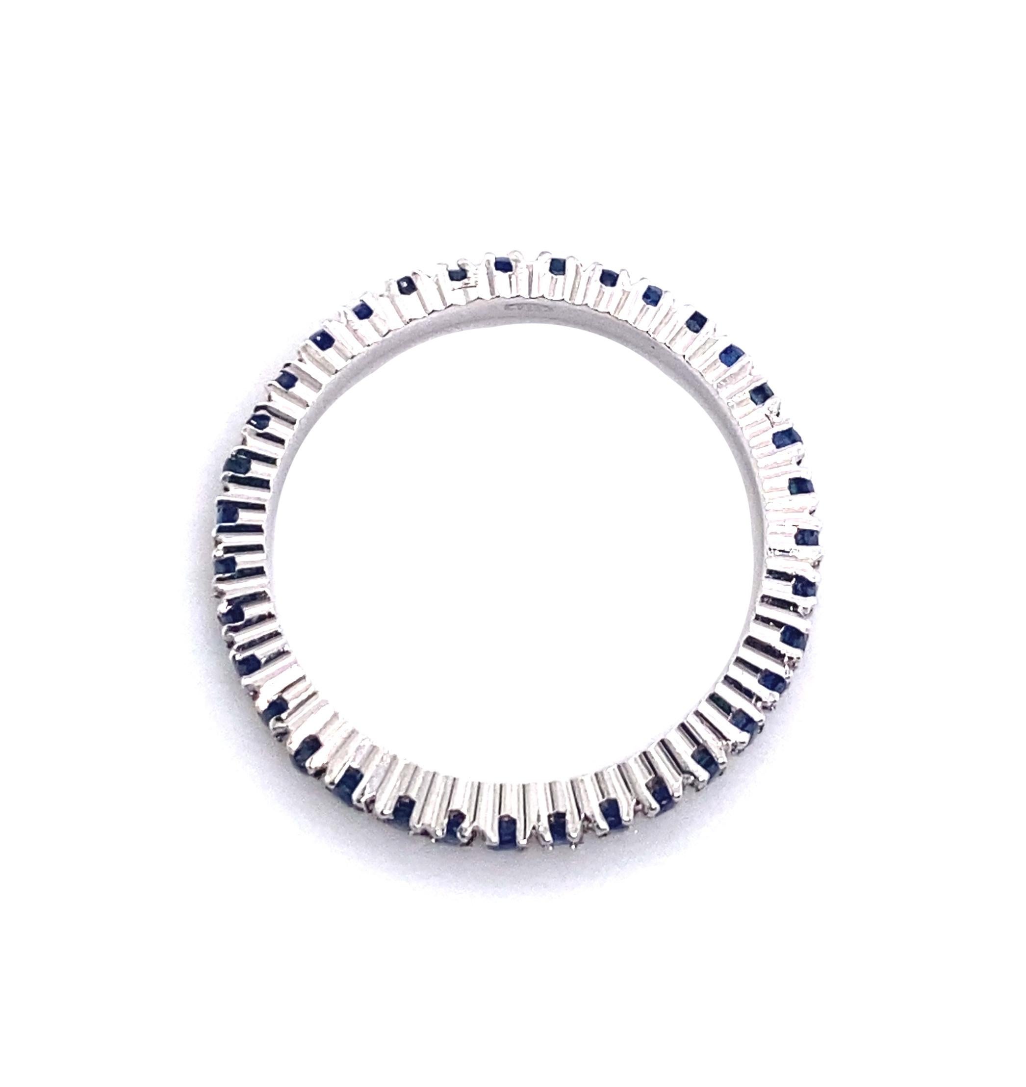 Contemporary 21st Century 18 Karat White Gold and Blue Sapphire Eternity Ring For Sale
