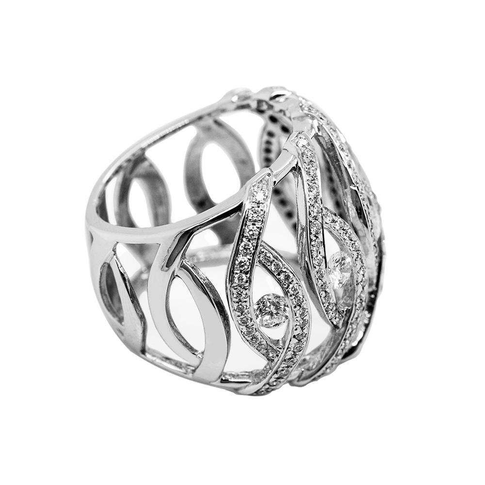 This 18-karat white gold and diamond cocktail ring is sleek and modern. It features 1.18 carats of G VS-rated brilliant-cut white diamonds set into an elegant design. 

Measuring 2.2 cm tall and weighing 10.2 grams, the photographed ring is a 13