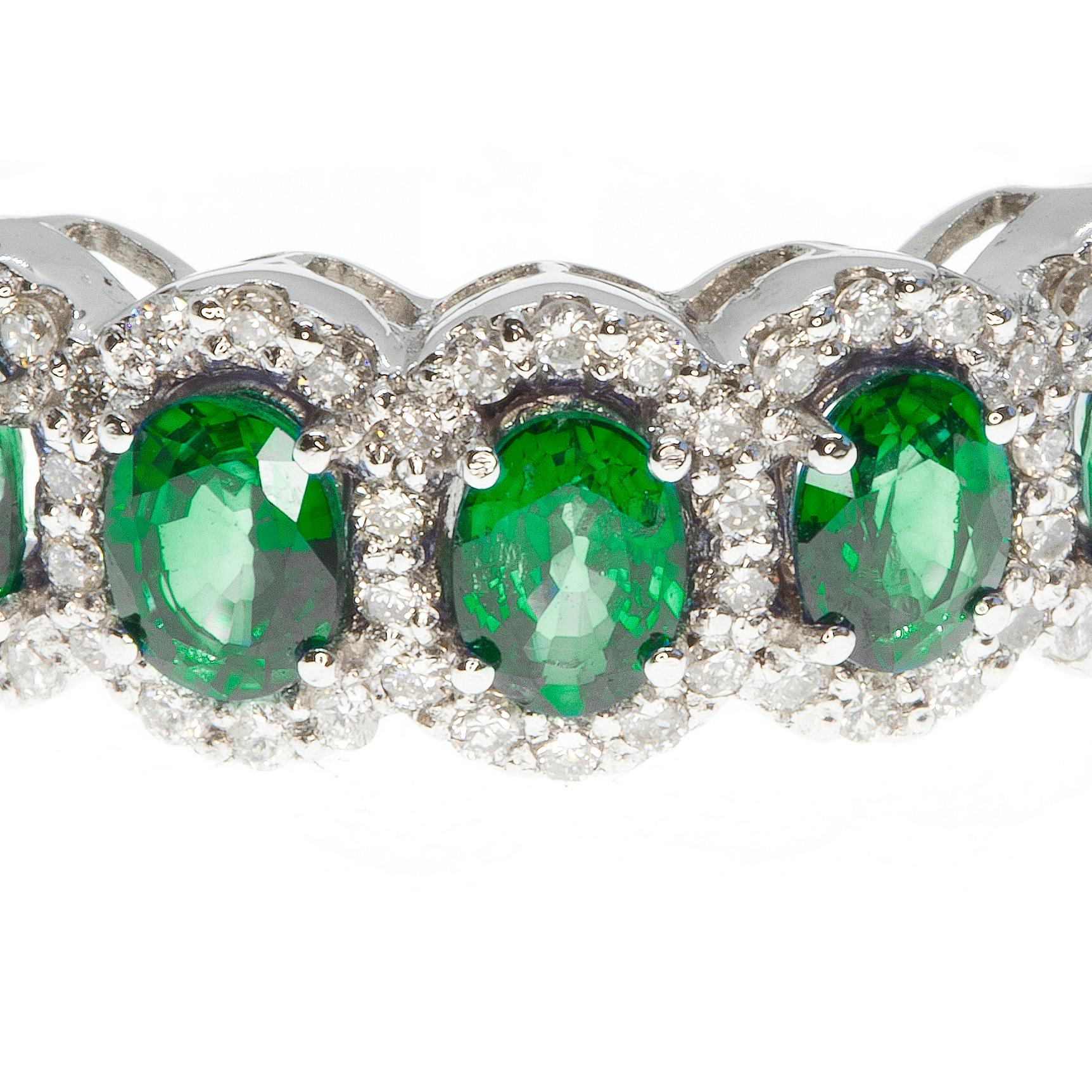 A beautiful ring, masterfully created entirely by hand and featuring carefully selected emeralds and white diamonds. The ring has been made from 18-karat white gold.

The ring is equally beautiful on its own or as the jewel of a stack of rings. The
