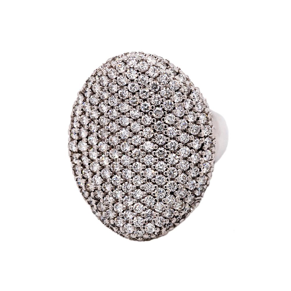 Prepare to make a striking statement with this magnificent large cocktail ring, an awe-inspiring creation that exudes opulence and glamour. Crafted from luxurious 18-karat white gold, this ring is a true testament to masterful design and