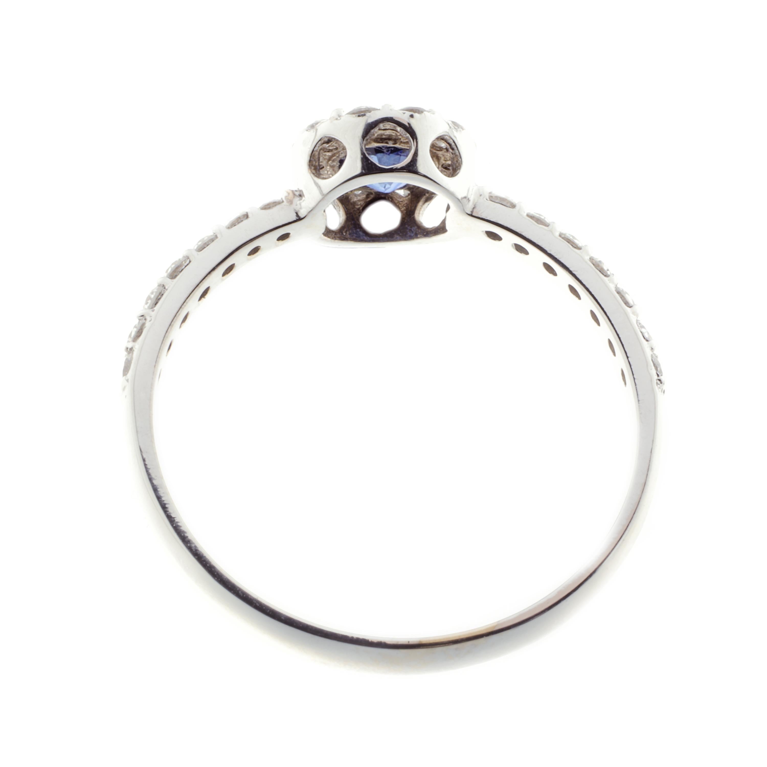 Round Cut 21st Century 18 Karat White Gold, G VS Diamond, Blue Sapphire Ring with Halo For Sale