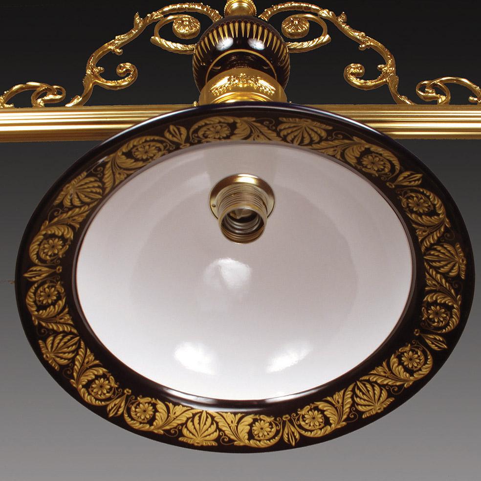 3 Lights billiard chandelier in porcelain and patinated gold bronze.
The parts in porcelain are decorated in pure gold decorations. The metal parts are in patinated gold bronze. Each object is handcrafted and the care for every detail makes each