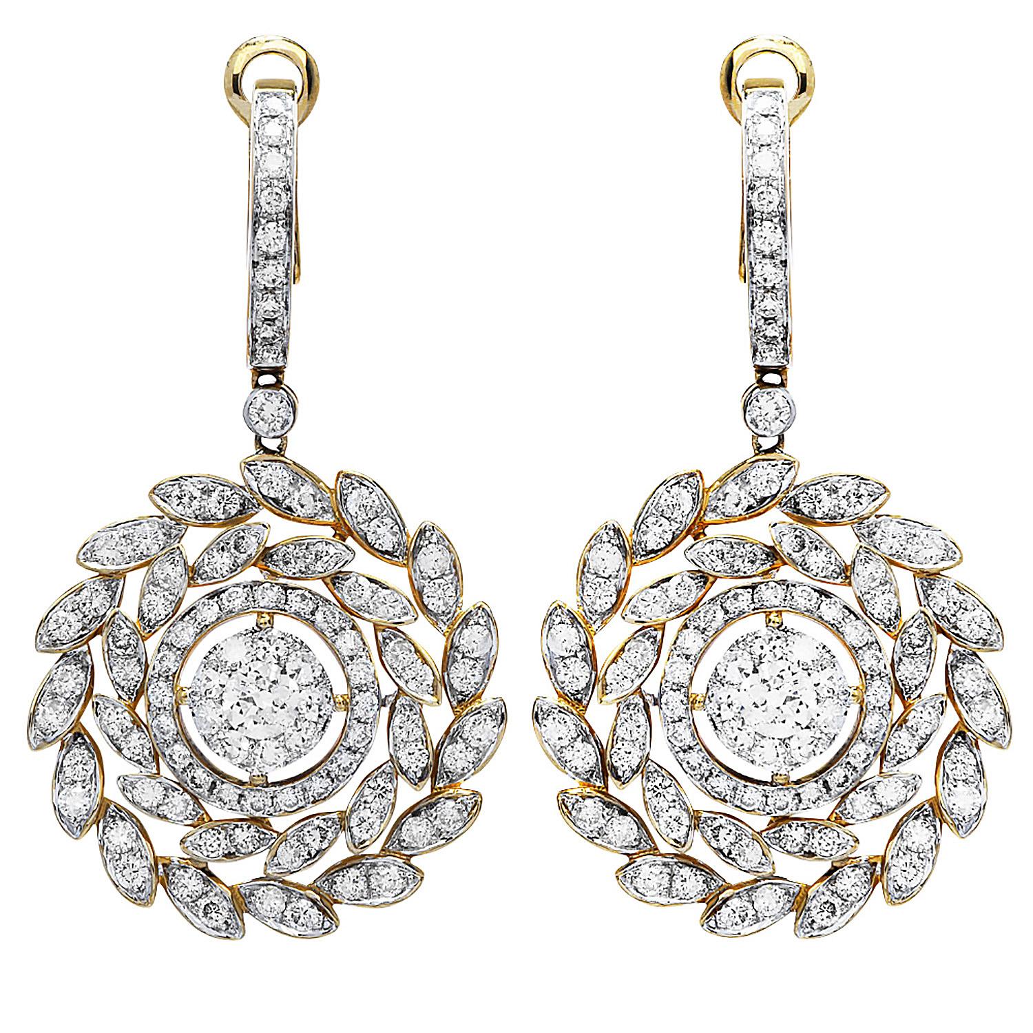 Twisted floral & vine-inspired dangle earrings.

These retro-style earrings were inspired in a Double Halo leaf and crafted in 

14K Yellow & White Gold.

 Featuring round cut diamonds throughout, these earrings 

have a cumulative diamond weight of