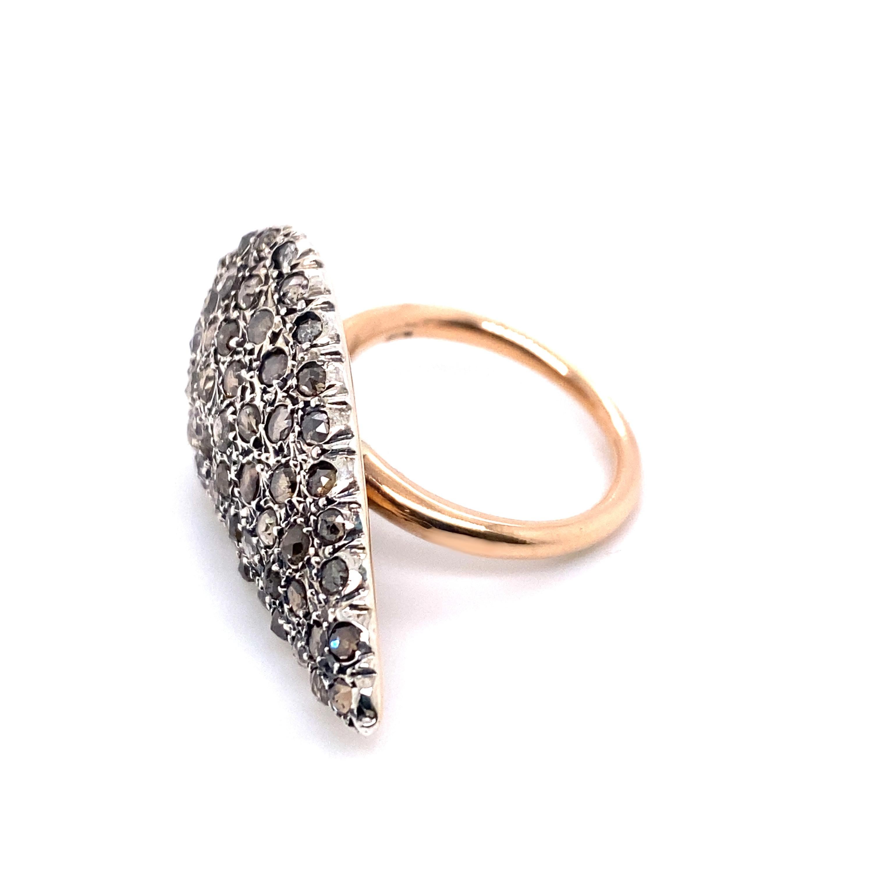 Understated and elegant, and yet 600-odd years in the making, this rose gold and silver cocktail ring is produced using an ancient Albanian technique that was brought to Palermo in the fifteenth century. 

In this piece, carefully selected diamonds,